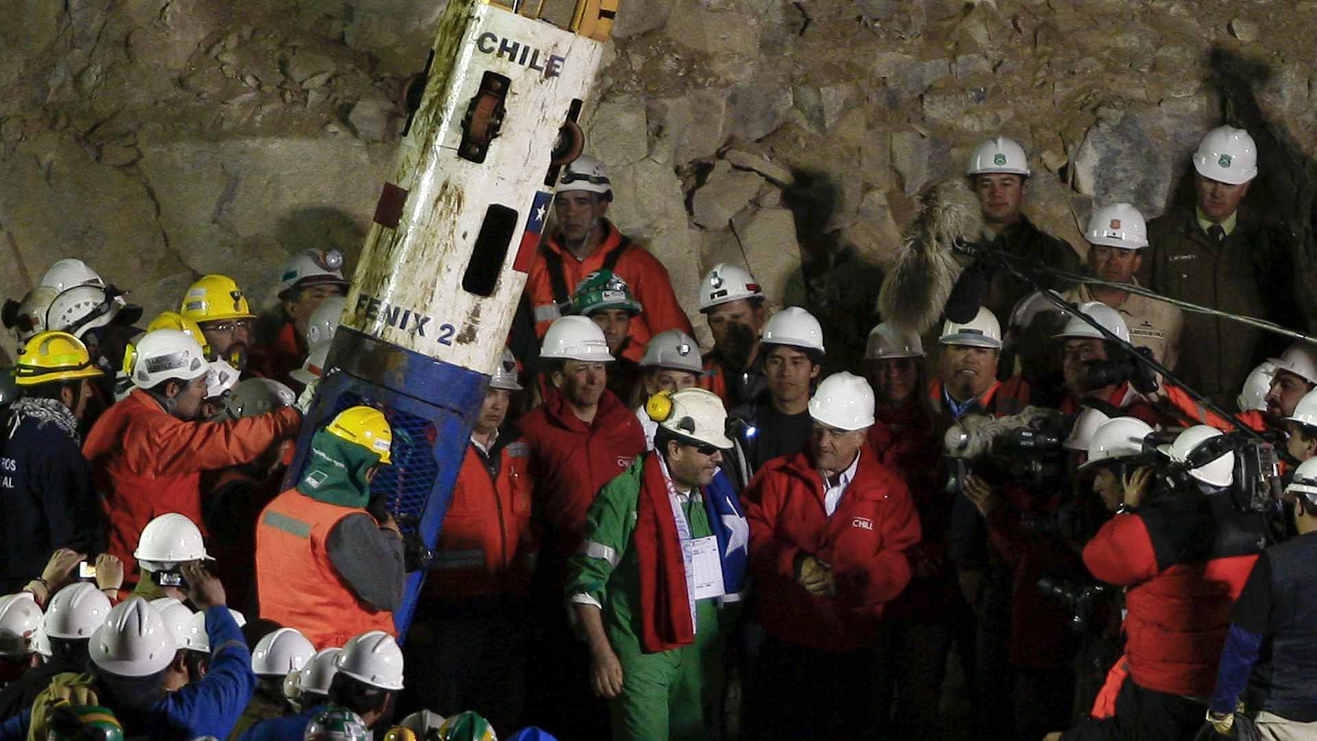 'It's been a bit of a long shift,' joked shift foreman Luis Urzúa (in green) after being greeted by Chile's President Sebastián Piñera. Urzúa was the last of the 33 miners to be successfully lifted to the surface after being trapped 700 meters underground for two months in the San José Copper-Gold mine, on October 13, 2010 in Copiapó, Chile.