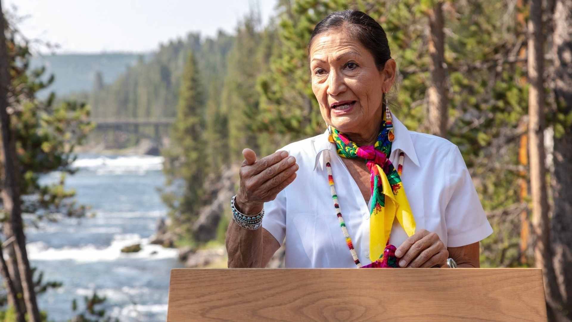 U.S. Interior Secretary Deb Haaland speaking out of doors.