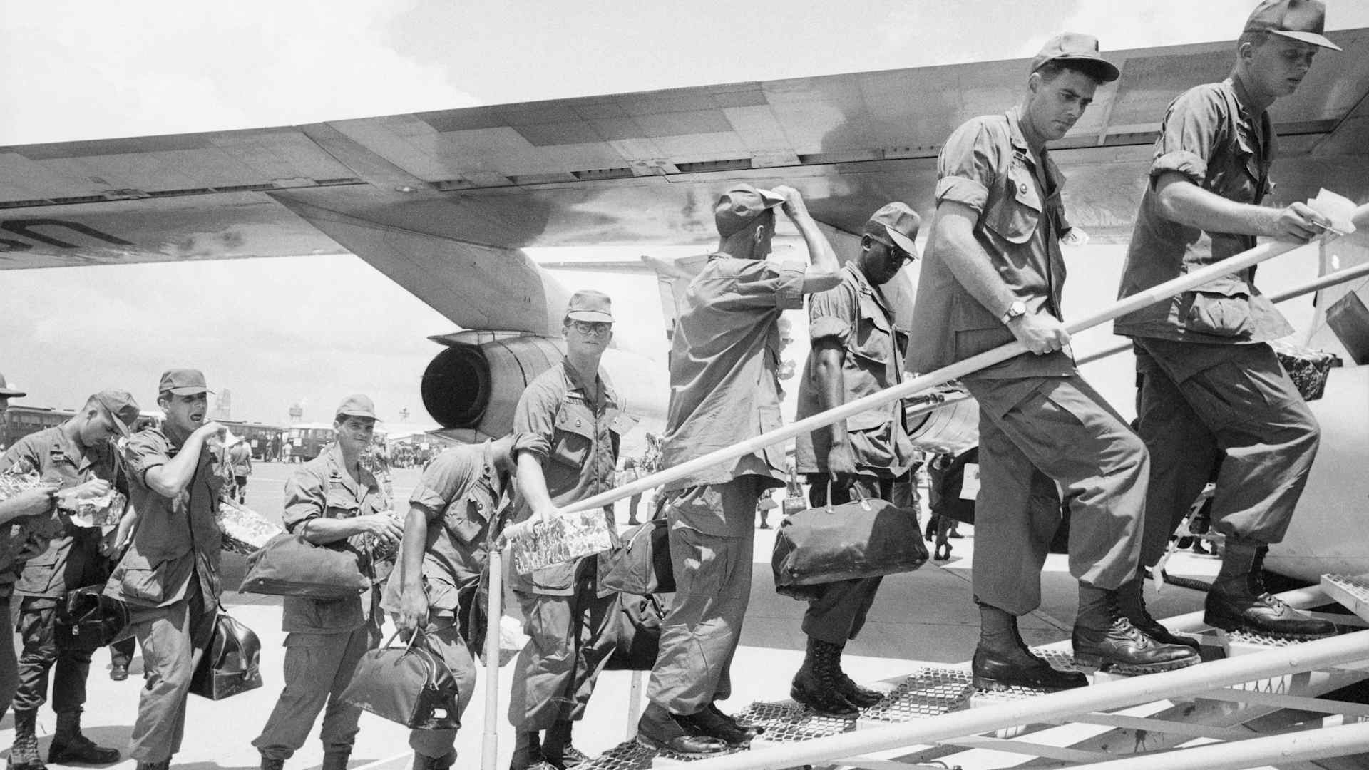 American Troops Boarding A Jet