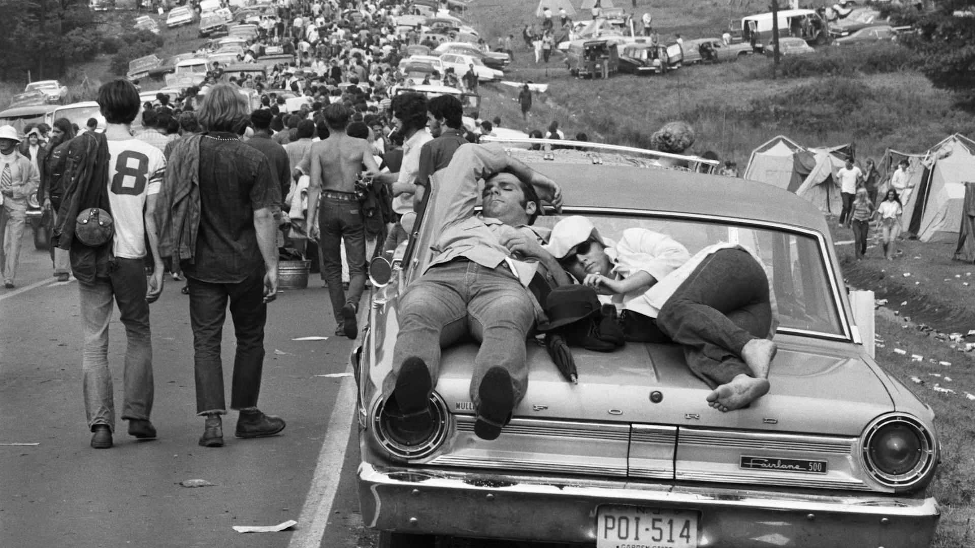 Couple Sleeping on Car at Woodstock, 1969