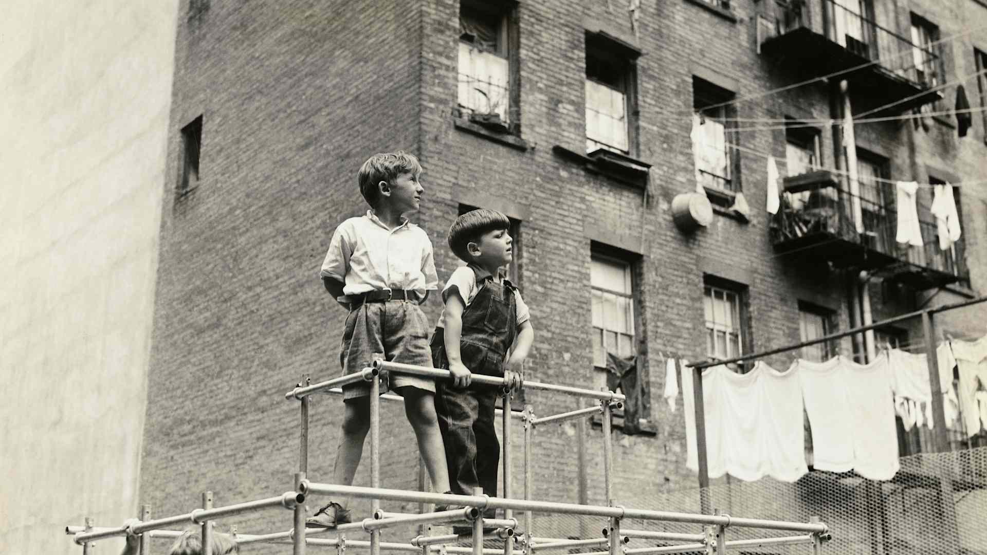 Boys Climbing Monkey Bars
