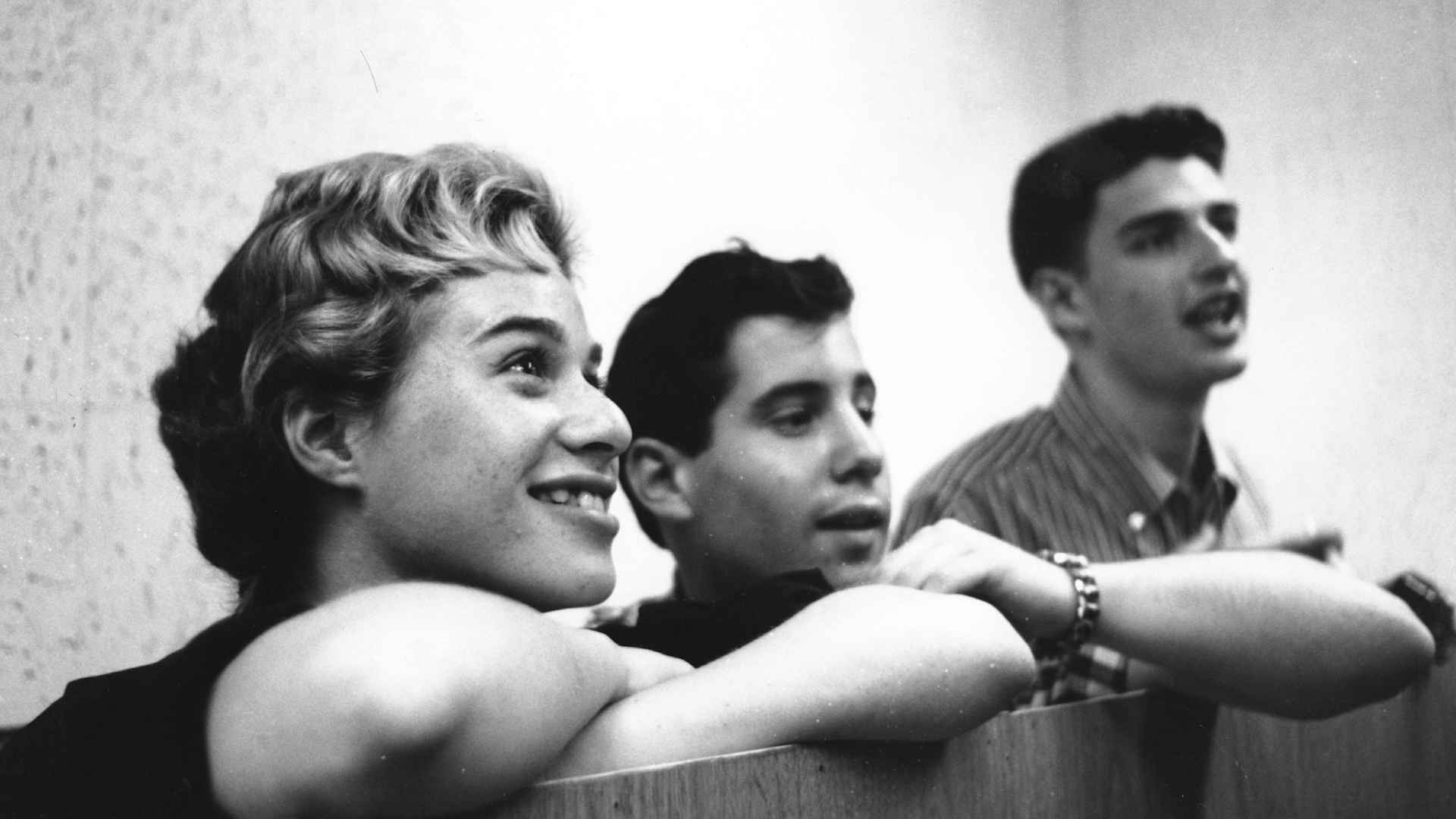 Singer Songwriters Carole King, Paul Simon and Gerry Goffin listening during a recording session.