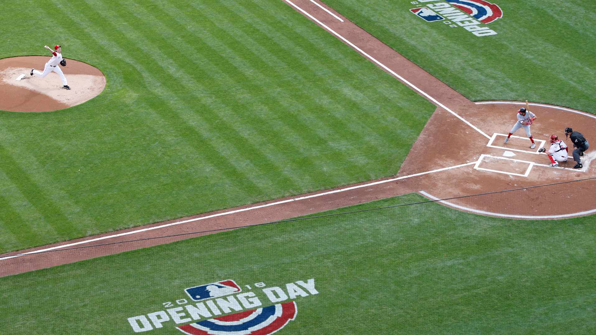 Aerial view of a major league baseball field, showing a pitcher about to throw to the batter, from an opening day game between the Washington Nationals and the Cincinnati Reds