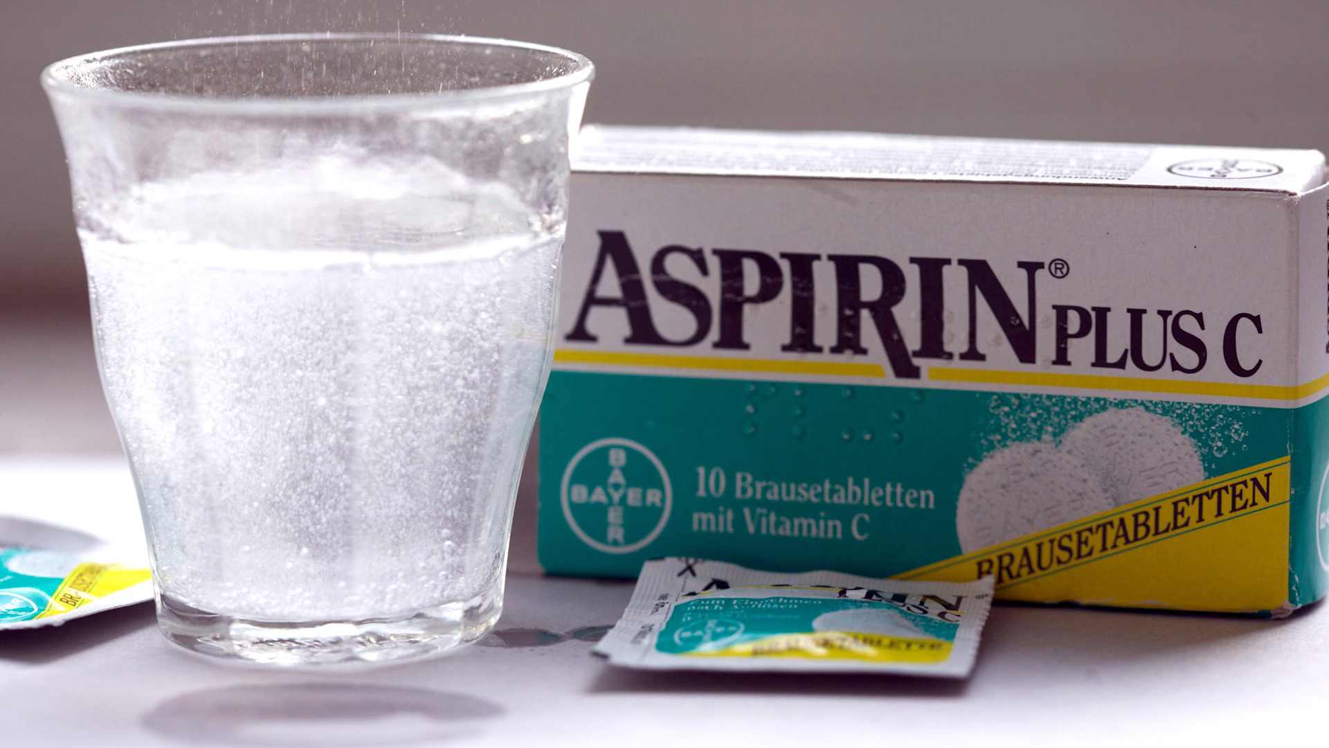Bayer aspirin tablets dissolve in a glass in Bonn, Germany,