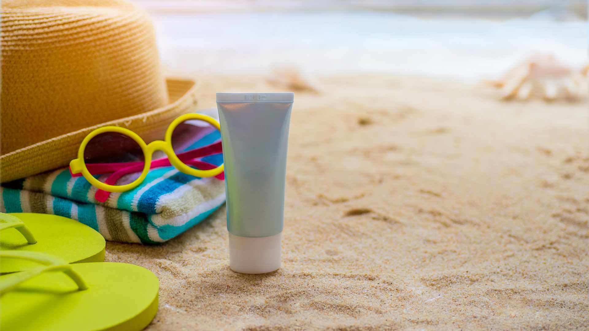 Beach Accessories On Table On Beach - Summer Holidays