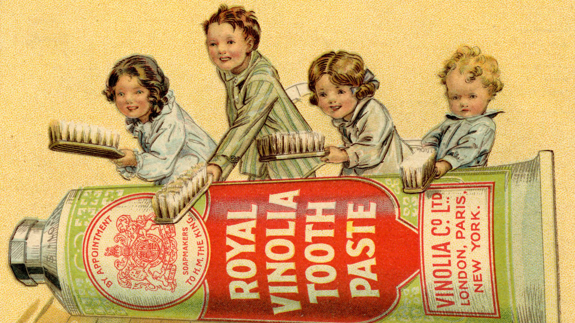 Hand-colored advertisement from the 1910s showing four children in pajamas holding giant toothbrushes leaning over a giant tube of toothpaste. Caption says: "Armed to the teeth."