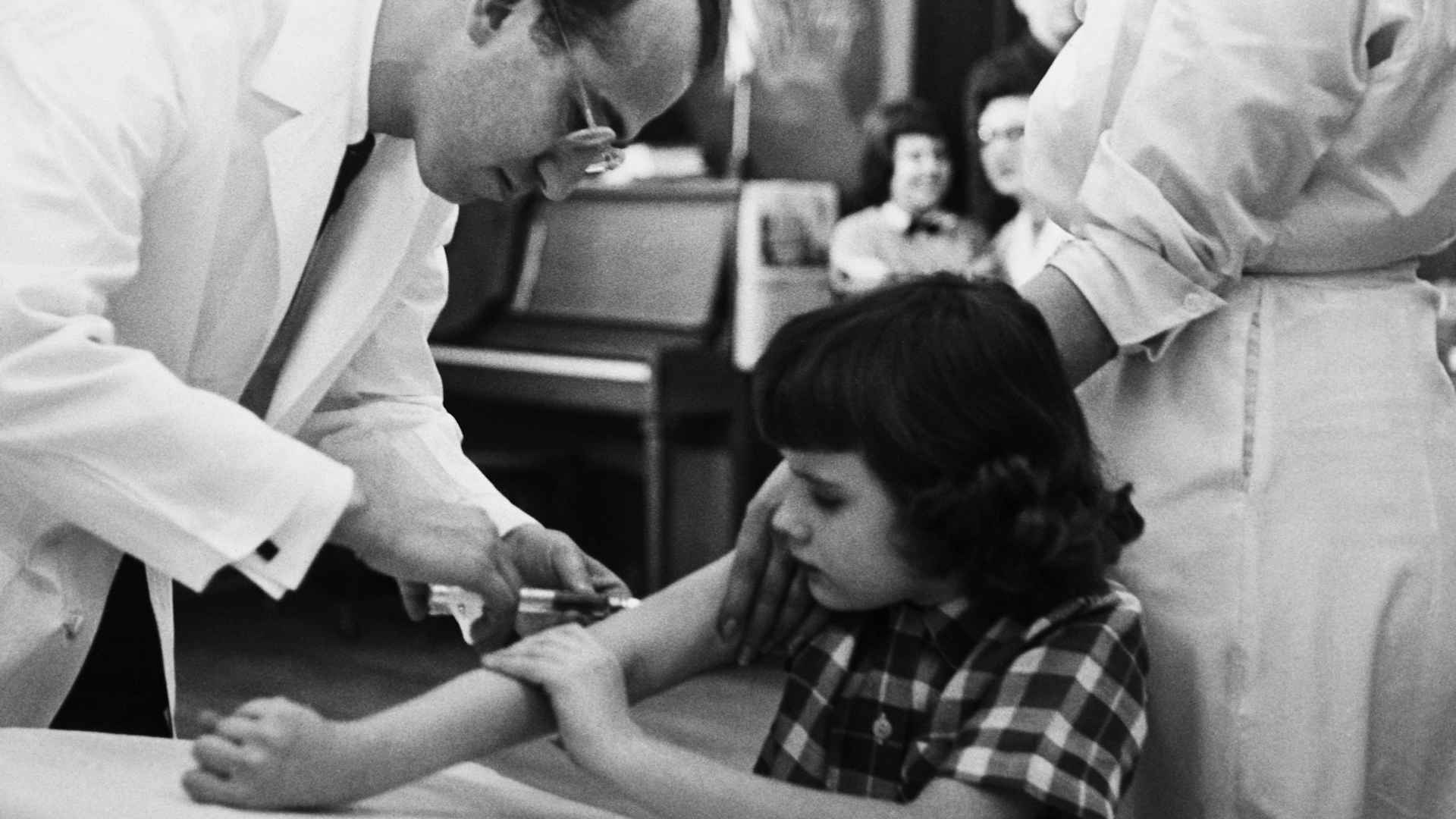 Jonas Salk Giving Girl Vaccination Shot