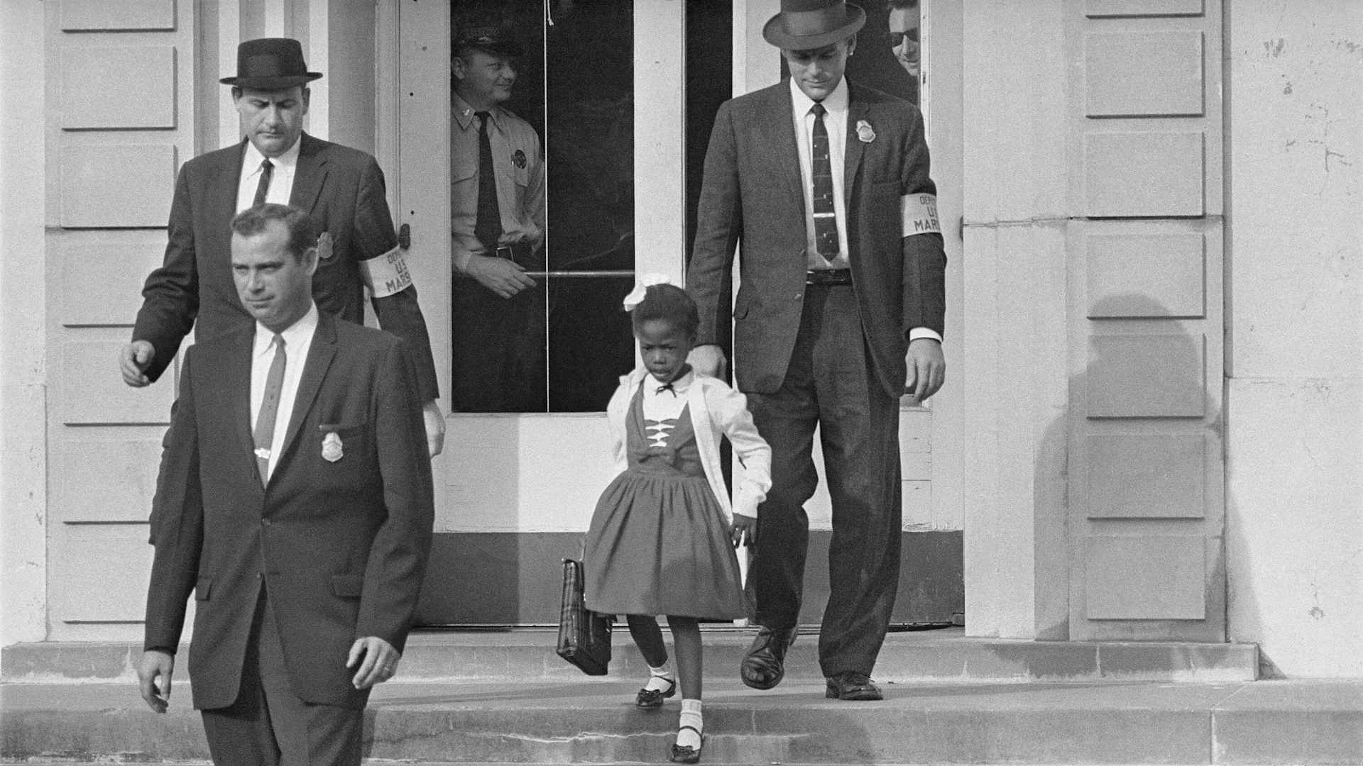 Due to threats and violence against her, U.S. Marshals escorted 6-year-old Ruby Bridges to and from the previously whites only William Frantz Elementary School in New Orleans, 1960. As soon as Bridges entered the school, white parents pulled their childre