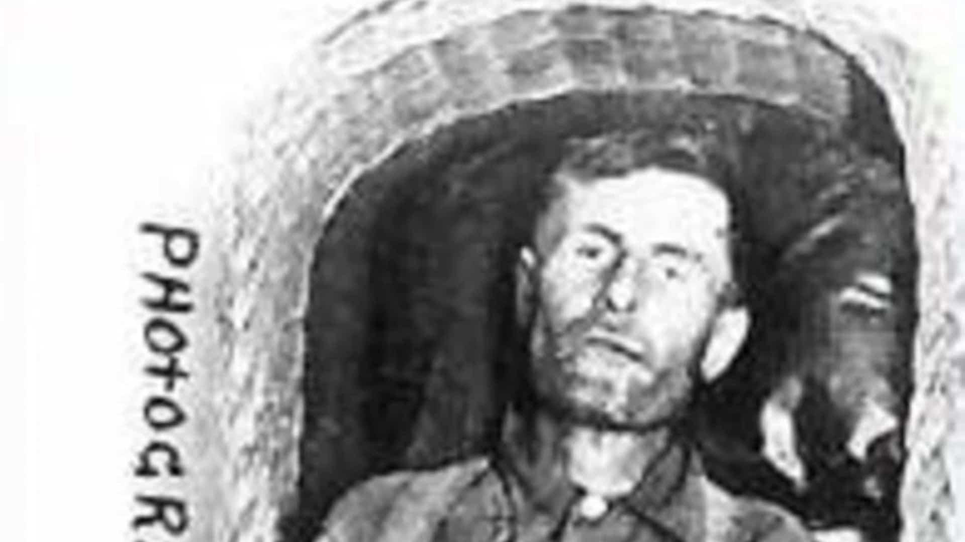 Elmer McCurdy's remains propped upright in a coffin.