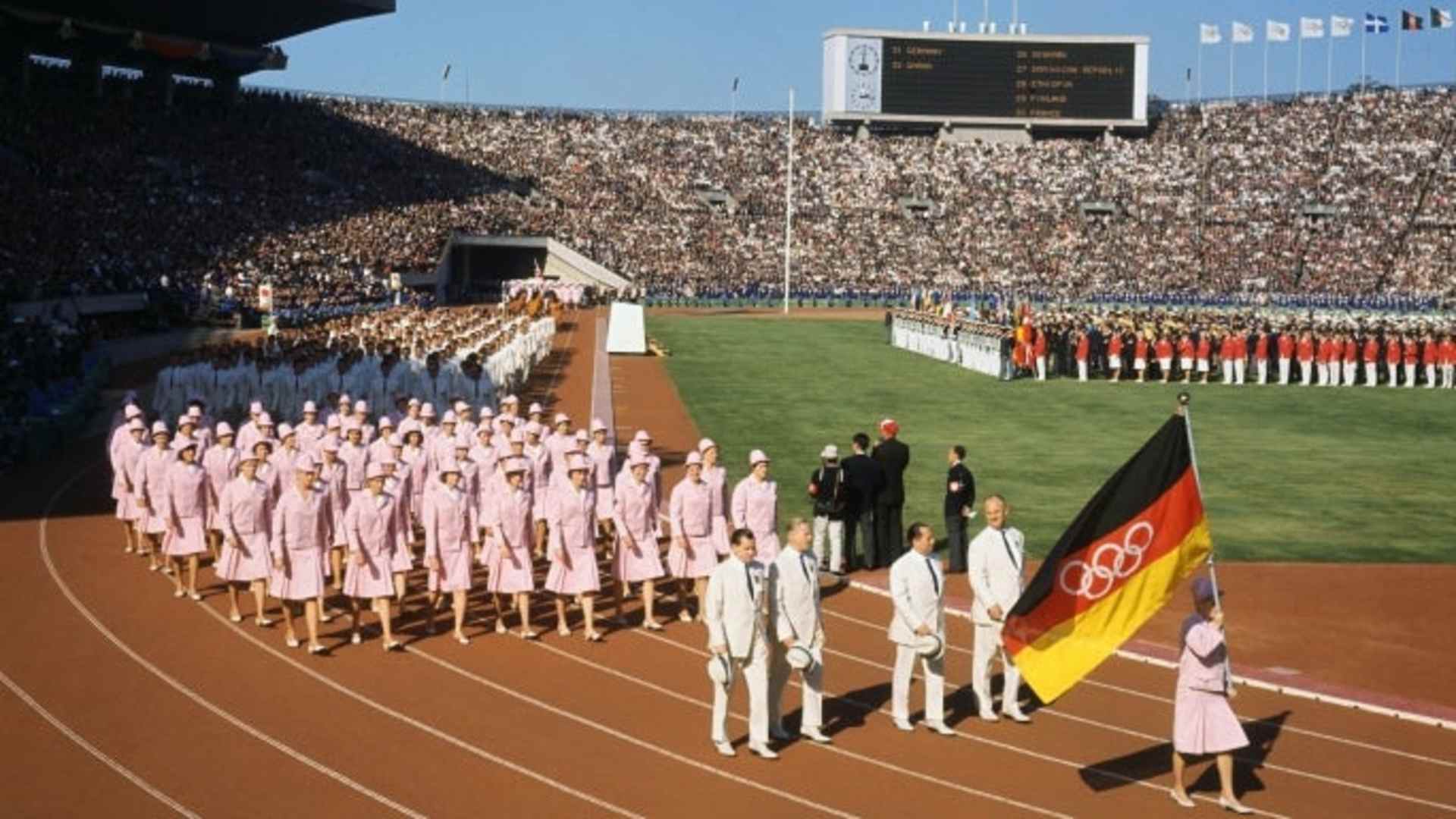 The German Team marching under a unified flag during the 1964 opening ceremony. (Credit: Bettmann Archive/Getty Images)