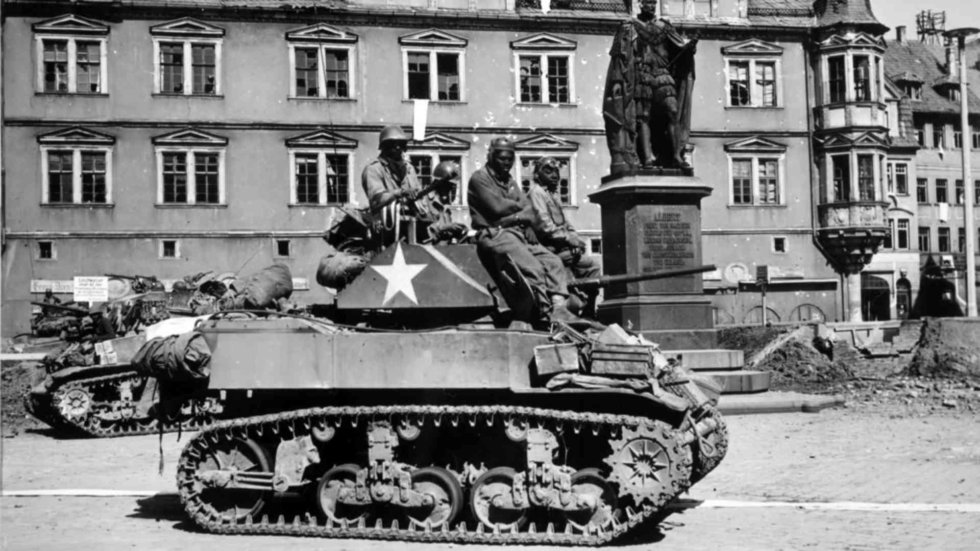 A tank and crew from the 761st Tank Battalion in front of the Prince Albert Memorial in Coburg, Germany, 1945. (Credit: The National Archives)