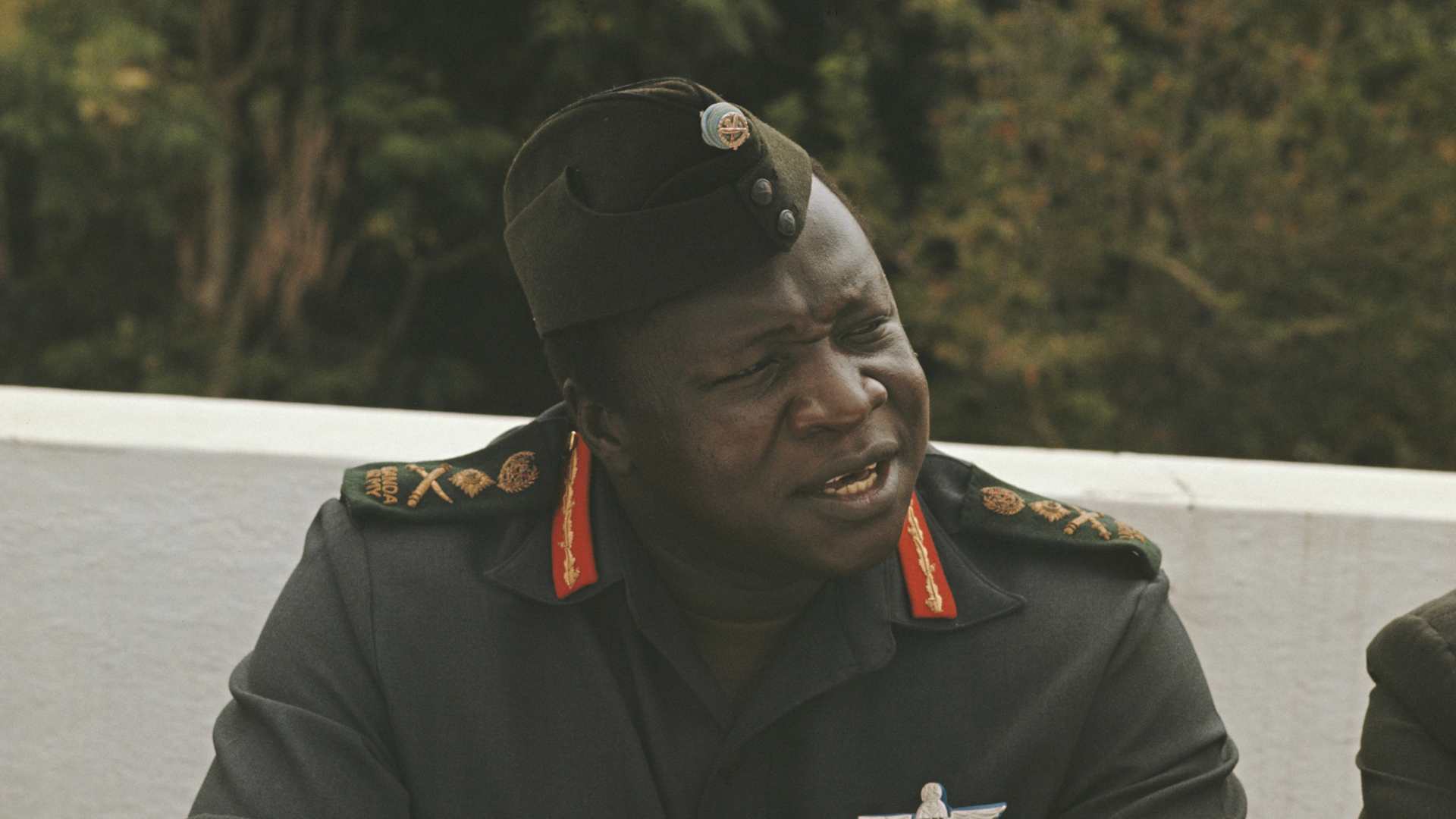 President of Uganda, Idi Amin pictured attending a lunch with British High Commissioner Richard Slater, the Indian High Commissioner, Pakistan's Ambassador and leaders of Uganda's Asian community at his house, known as 'The Command Post' in Kampala, Uganda in August 1972.