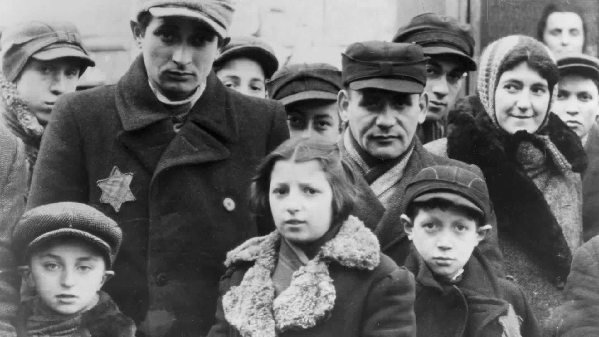 Jews wearing Star of David badges, Lodz Ghetto, Poland, World War II, 1940-1944. The Nazis forced Jews into over-crowded ghettos from which thousands were deported to the death camps.