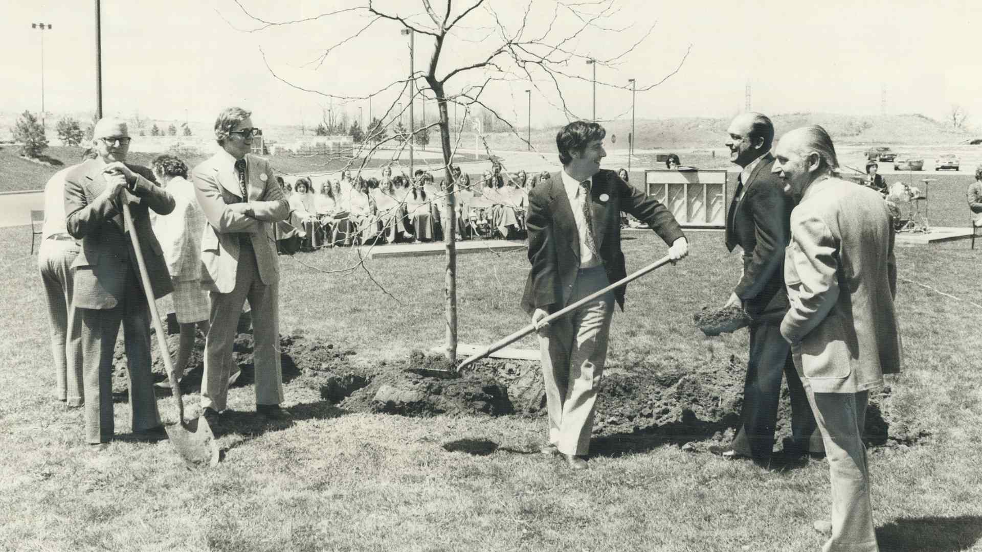 CANADA - MAY 07: Arbor Day in Mississauga. Mayor Martin Dobkin plants a sunburst loust tree in front of city hall yesterday to inaugurate Arbor Day in Mississauga. Ceremony was just one of many throughout Peel and Halton Regions. Council members watched mayor's efforts. (Photo by Frank Calleja/Toronto Star via Getty Images)