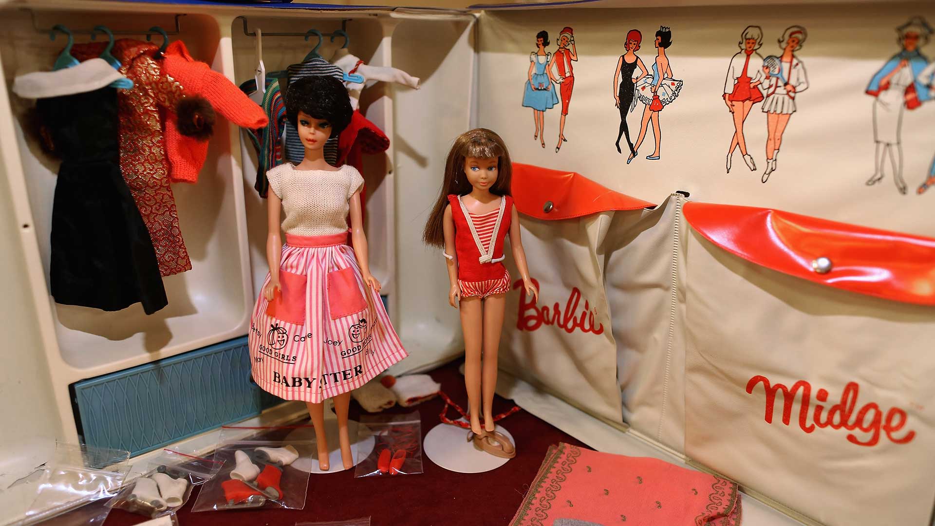 A vintage Barbie and Midge with carrying case.