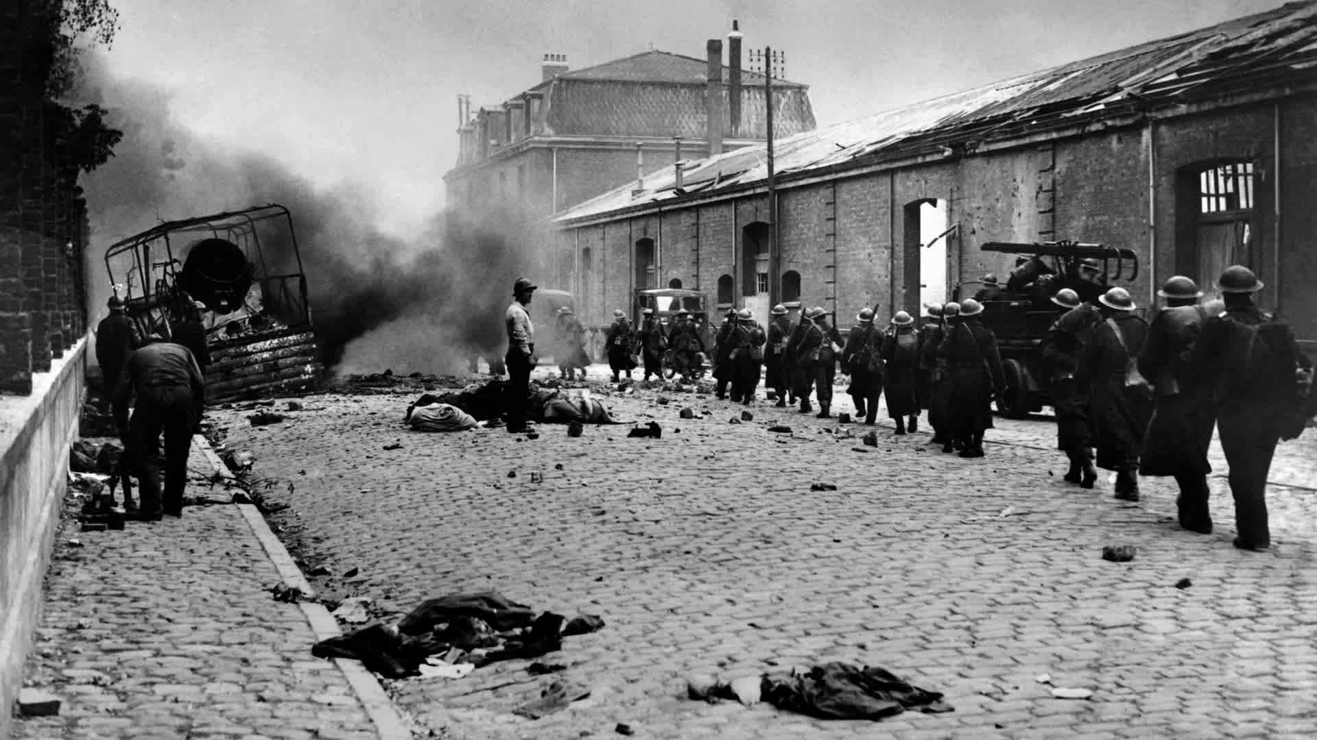 FRANCE-WAR-ARMY-BATTLE Undated picture of troops crossing the mids of debris of the rubble-strewn streets in Dunkerque, France, during the 2nd World war. (Photo by - / AFP) (Photo credit should read -/AFP via Getty Images)
