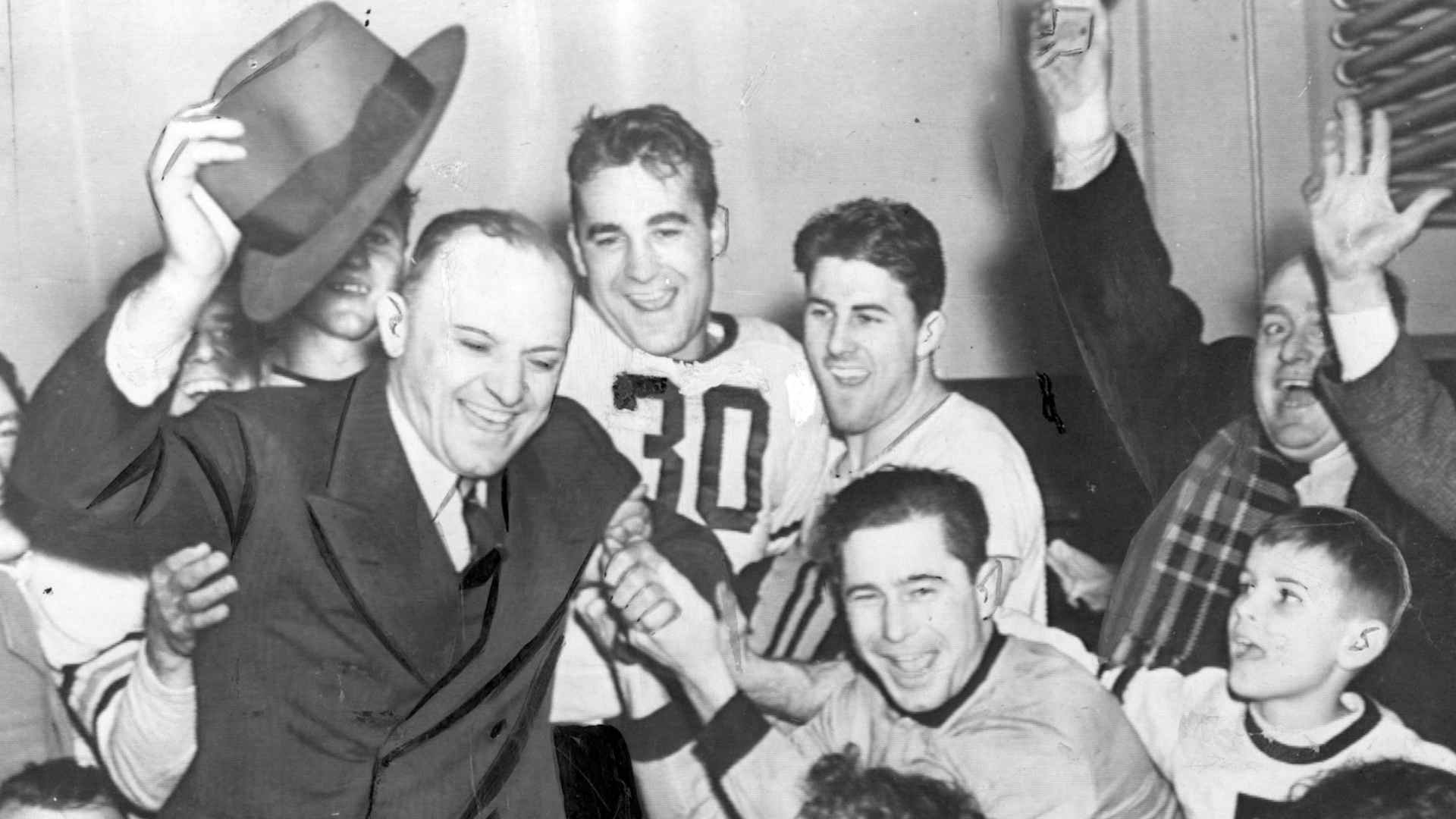 Chicago Bears coach George Halas (left) celebrates with his team following its 73-0 win over Washington in the 1940 NFL Championship game.