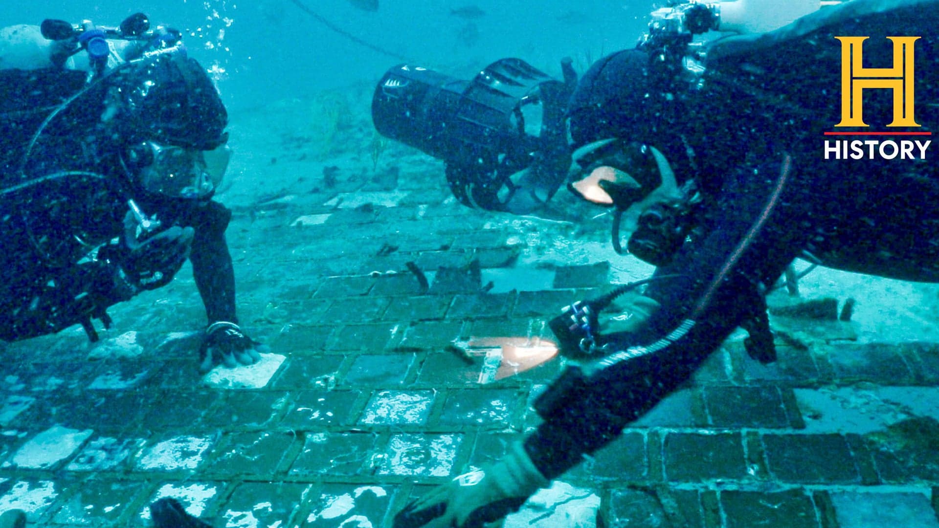 Underwater explorer and marine biologist Mike Barnette and wreck diver Jimmy Gadomski explore a 20-foot segment of the 1986 Space Shuttle Challenger that the team discovered in the waters off the coast of Florida.
