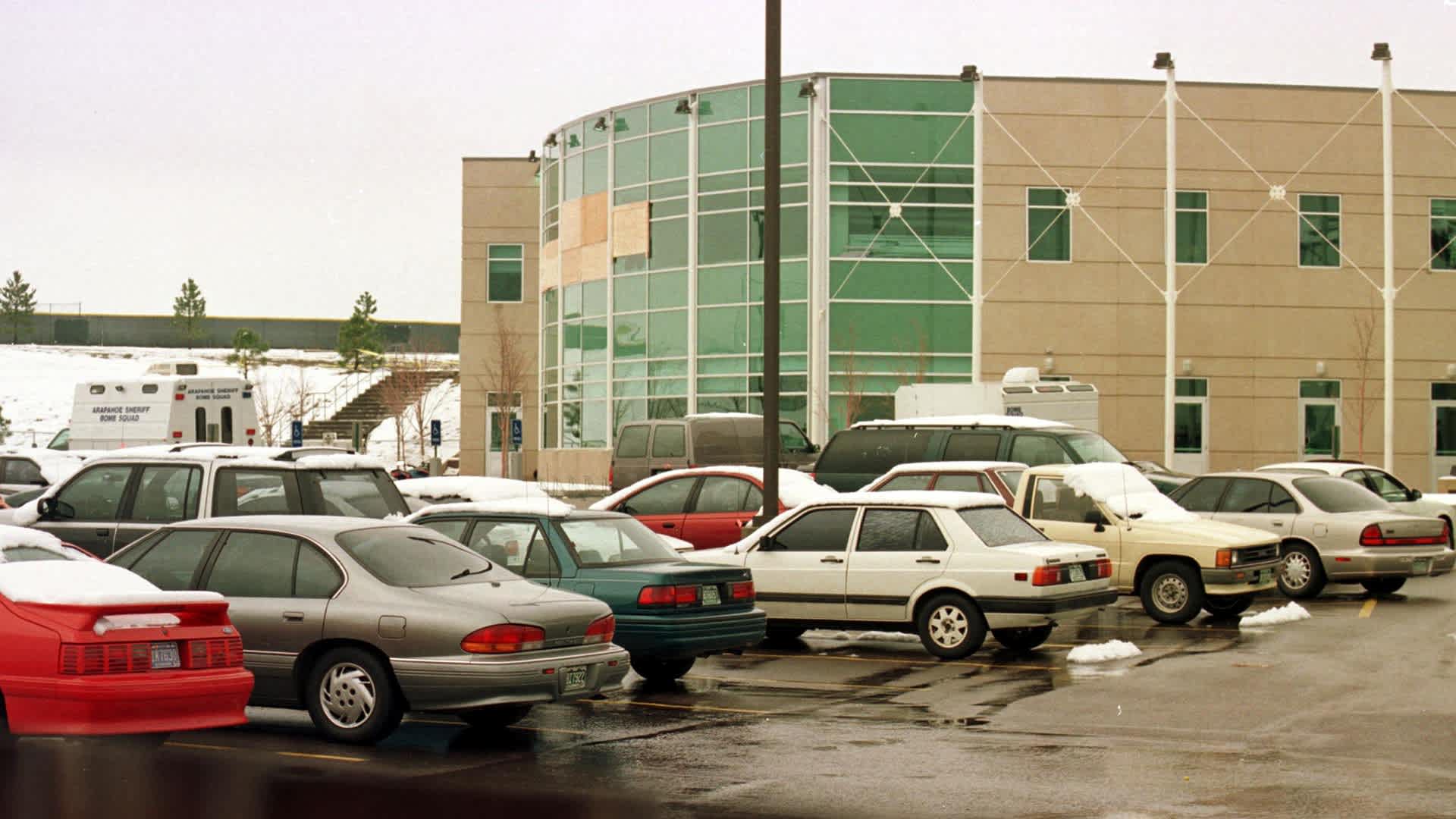A view from the parking lot at the rear of Columbine High School in Littleton, Colorado, shows the cafeteria and library with windows missing on April 22, 1999, at the site where fourteen students and one teacher were killed on April 20, 1999 when two students opened fire on their classmates.
