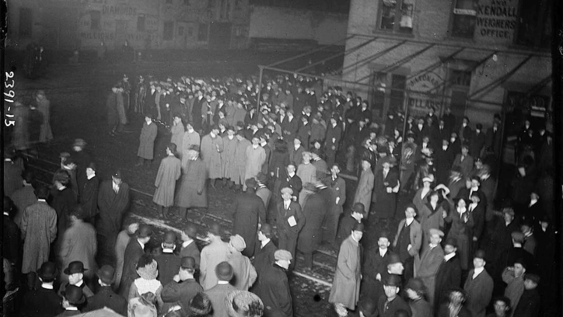 A crowd awaits Titanic survivors.