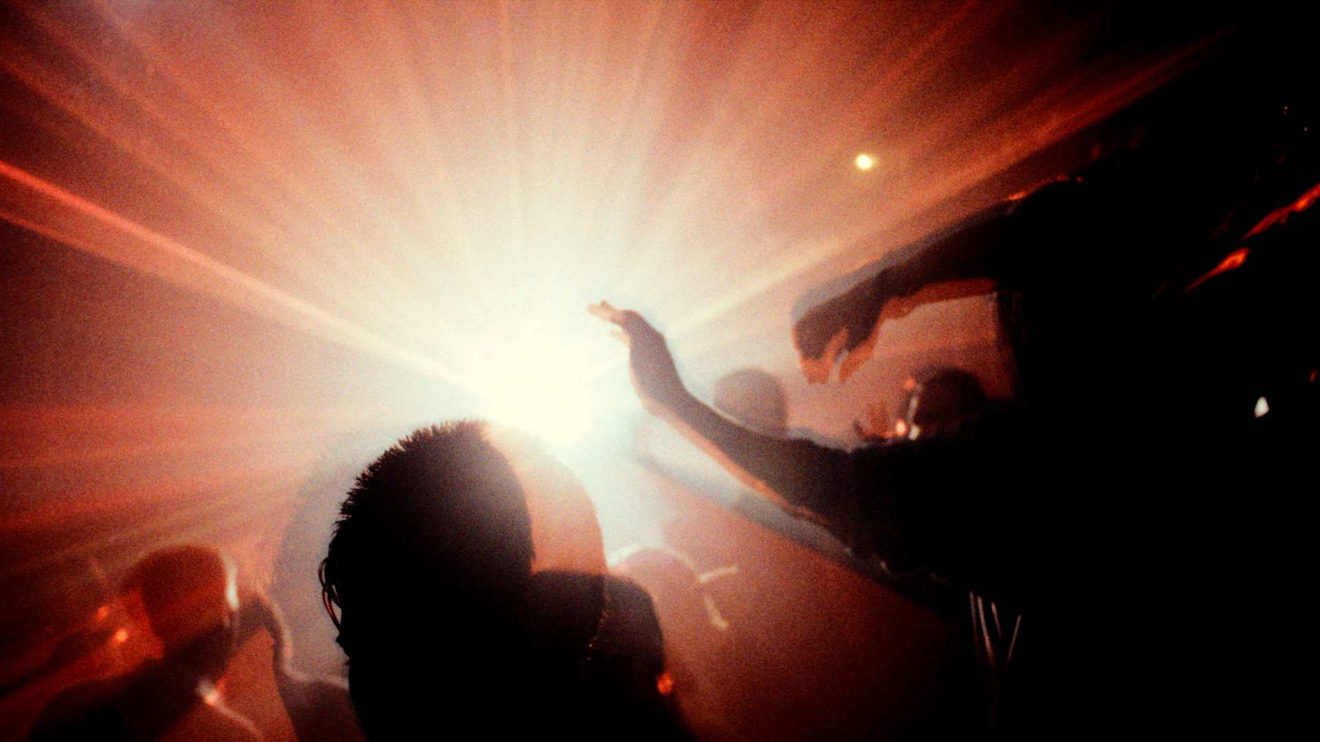 Crowd with lights Megatripolis London UK 1990's (Photo by Universal Images Group via Getty Images)