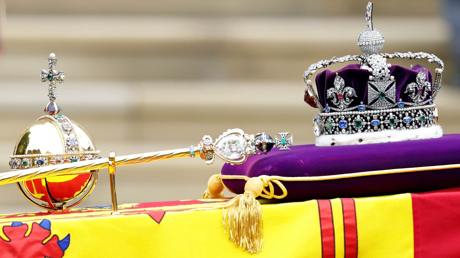 The Sovereign's Orb, Sceptre and The Imperial State Crown sit on top of Queen Elizabeth II's Royal Standard draped coffin at her Committal Service at St George's Chapel, Windsor Castle on September 19, 2022 in Windsor, England.