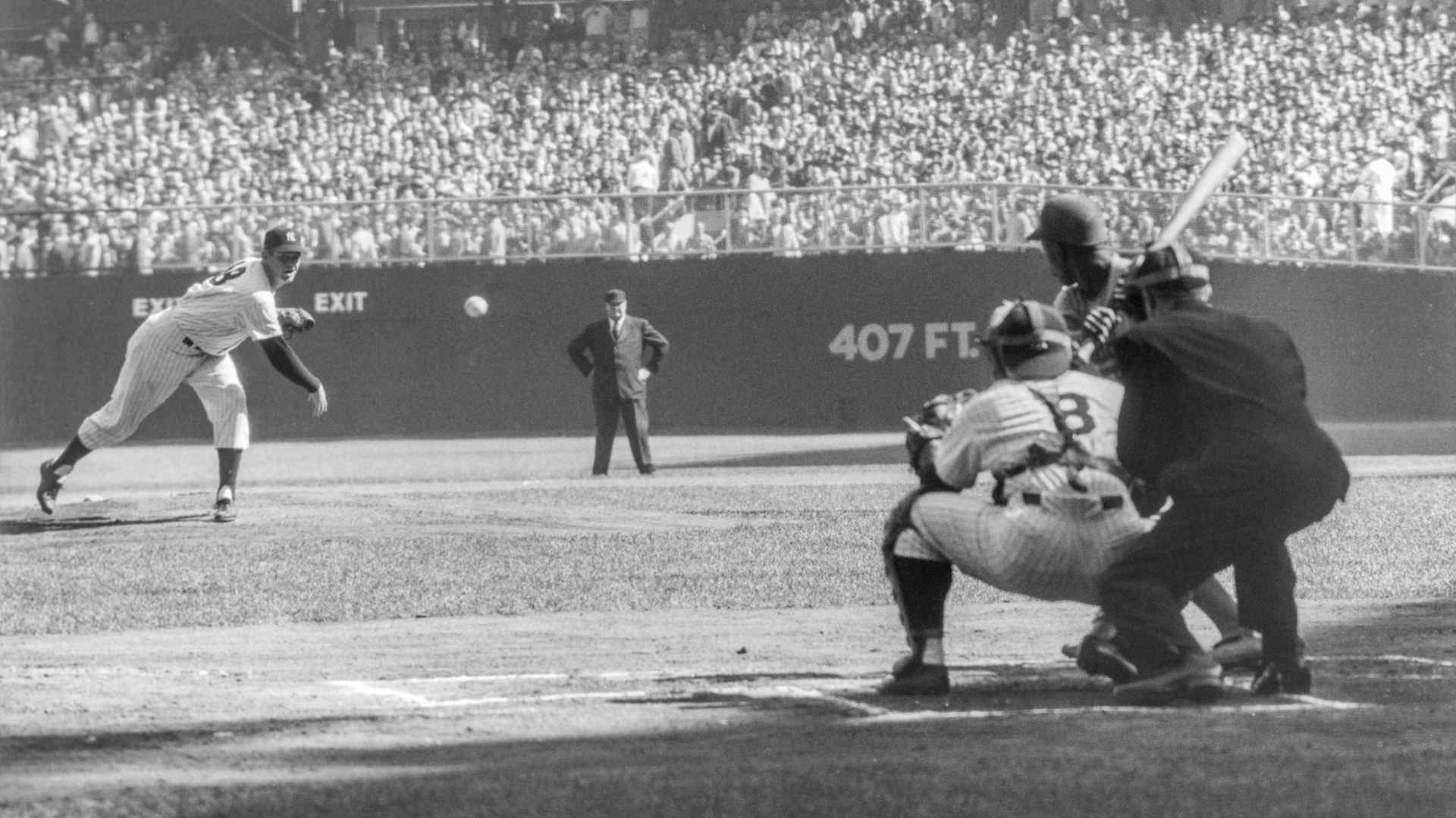 Pitcher Don Larson of the New York Yankees delivers the first pitch to Jim Gilliam of the Brooklyn Dodgers as catcher Yogi Berra and umpire Babe Pinelli look on during Game 5 of the 1956 World Series on October 8, 1956 at Yankee Stadium. Larson would go on to pitch a perfect game against the Dodgers. (Photo by Stanley Weston/Getty Images)