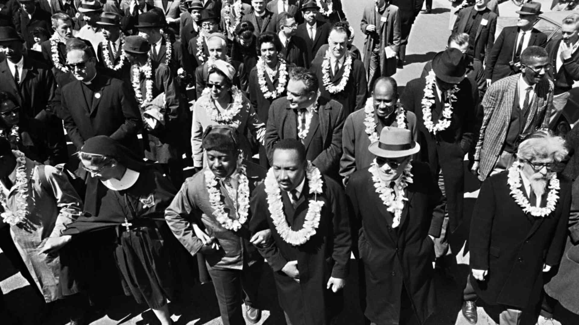 Dr. Martin Luther King, Jr.leading marchers as they begin the Selma to Montgomery civil rights march from Brown's Chapel Church in Selma, Alabama. (Credit: Bettmann Archive/Getty Images)