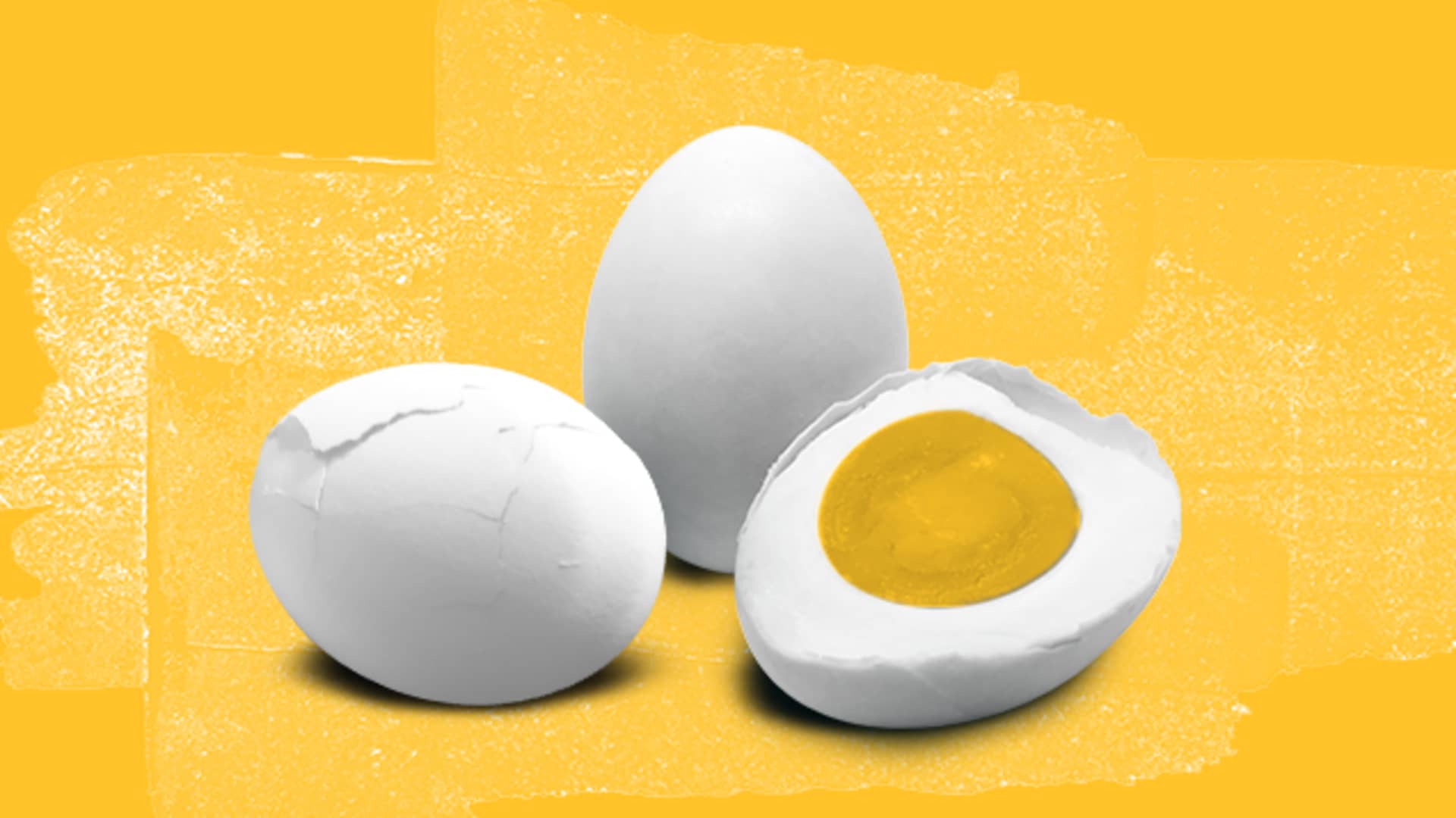 Three boiled eggs, one halved.