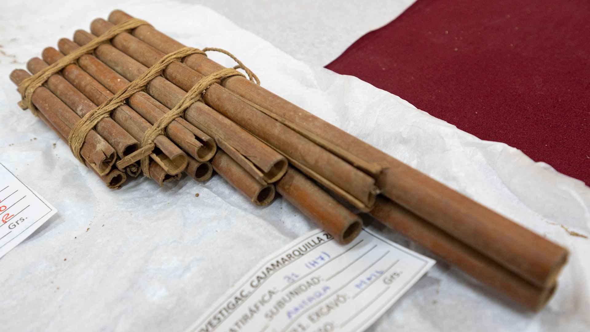A musical instrument is among diverse artifacts displayed together with six funerary mummy bundles belonging to the Wari Culture dug by archaeologists at a pre-Inca complex modernly known as the Cajamarquilla archeological center on the western outskirts of Lima