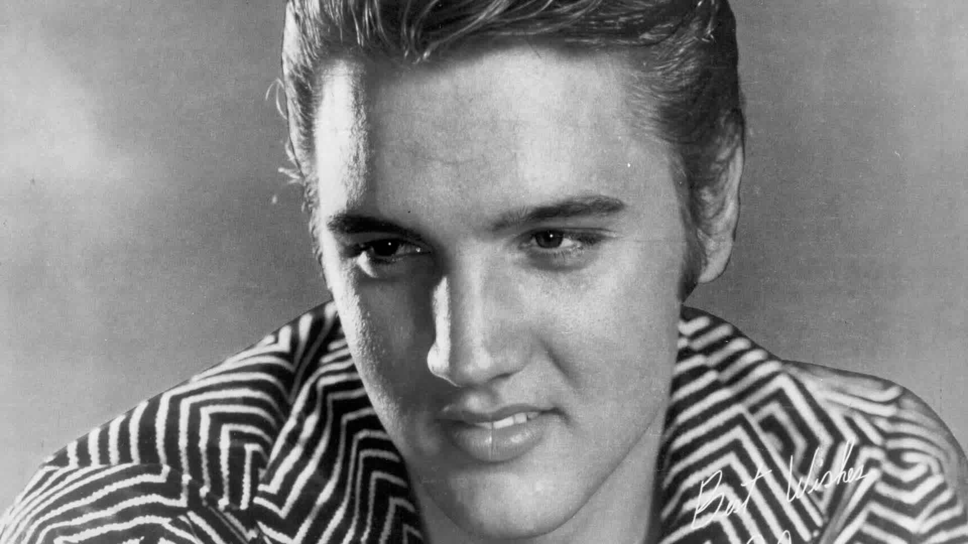 Rock and roll singer Elvis Presley poses for a portrait in 1956.