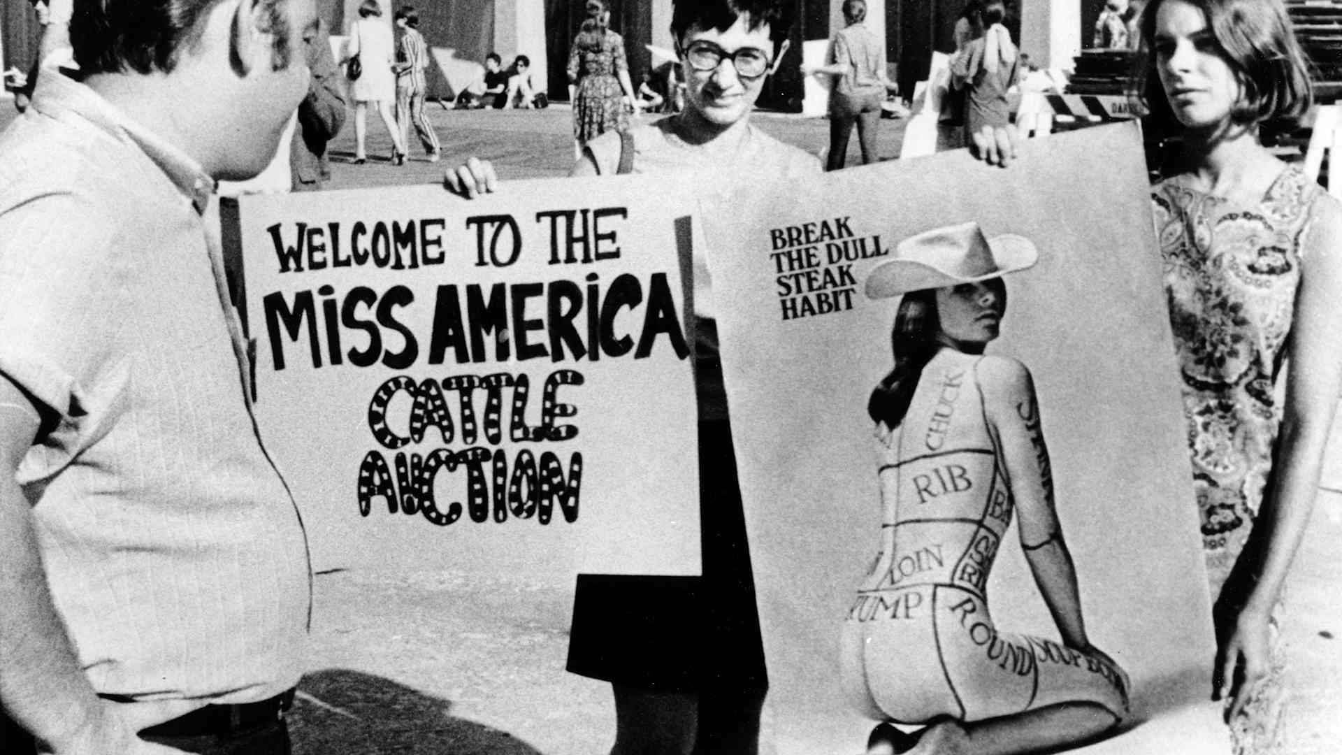 Members of the National Women's Liberation Party hold protest signs outside of the 1968 Miss America Pageant. (Credit: AP Photo)