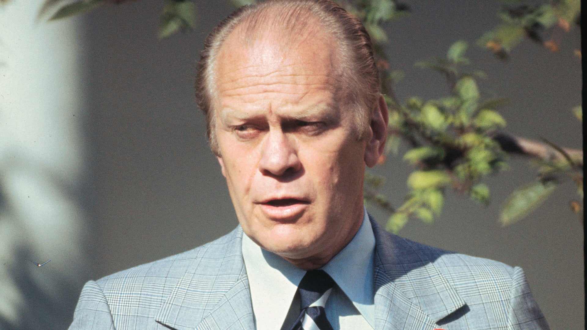 President Gerald Ford wearing a WIN (Whip Inflation Now) button on his lapel during Republican campaigns in North & South Carolina.