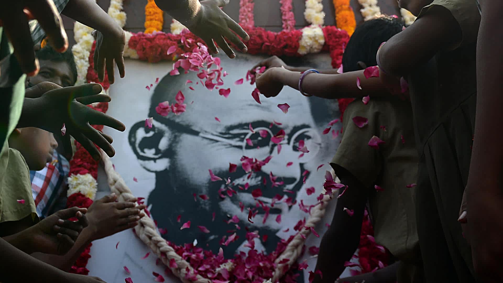 Indian school children pay homage to a portrait of Indian independence icon Mahatma Gandhi to mark the 70th anniversary of Gandhi's assassination. Gandhi was on the way to a prayer meeting in the Indian capital when he was shot three times in the chest and head on January 30, 1948.
