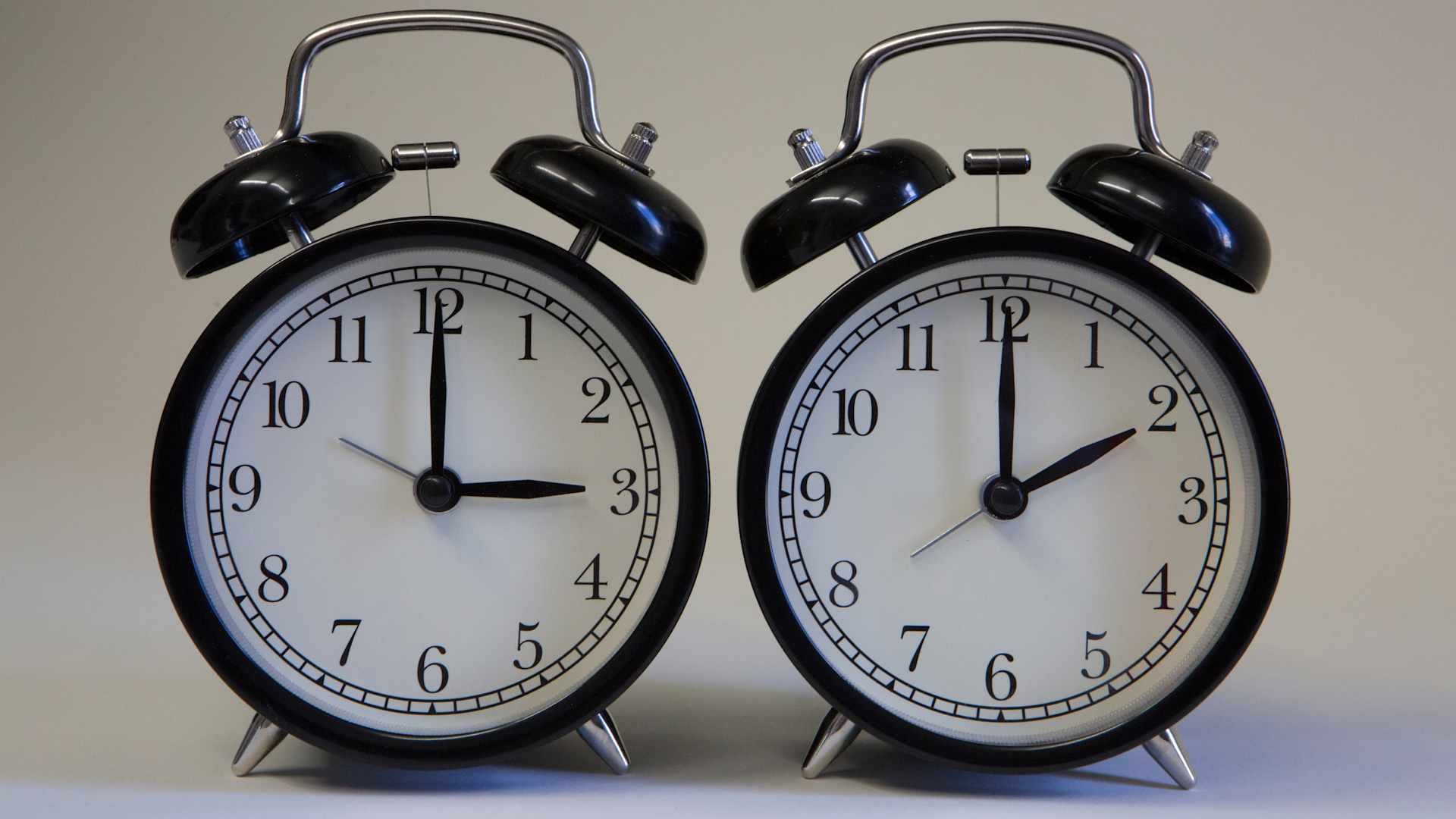 Clocks falling back showing Daylight Saving Time