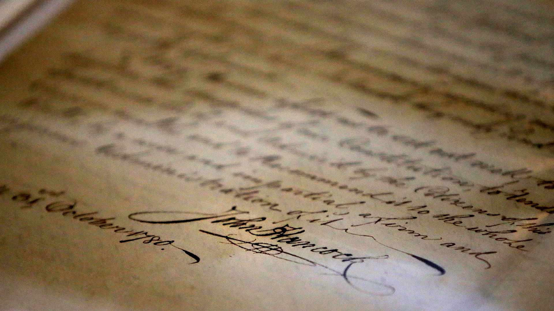 BOSTON, MA - JANUARY 29: John Hancock's signature is seen at the bottom of his inaugural address as Governor, a document stored at the Massachusetts State Archives in Boston on Jan. 29, 2019. Massachusetts officials on Tuesday unveiled a new vault to store the commonwealth's myriad historical treasures and documents accumulated over nearly four centuries. The expanded 25,000 square-foot space in Dorchester allow the archives to grow after the Columbia Point building reached a "critical point" of limited space, said Michael Comeau, executive director of the archives. The space also features modern environmental and security controls. (Photo by Lane Turner/The Boston Globe via Getty Images)