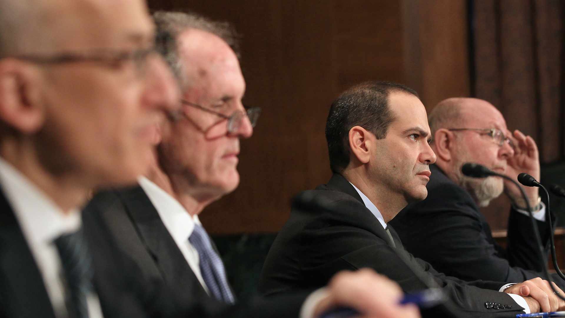 Assistant Treasury Secretary Timothy Massad of the Office of Financial Stability, TARP Congressional Oversight Panel Chairman Ted Kaufman, Special Inspector General of the Troubled Asset Relief Program Neil Barofsky and Thomas McCool, director of the Government Accountability Office's Center for Economics, participate in a Senate Banking, Housing and Urban Affairs Committee hearing, on March 17, 2011
