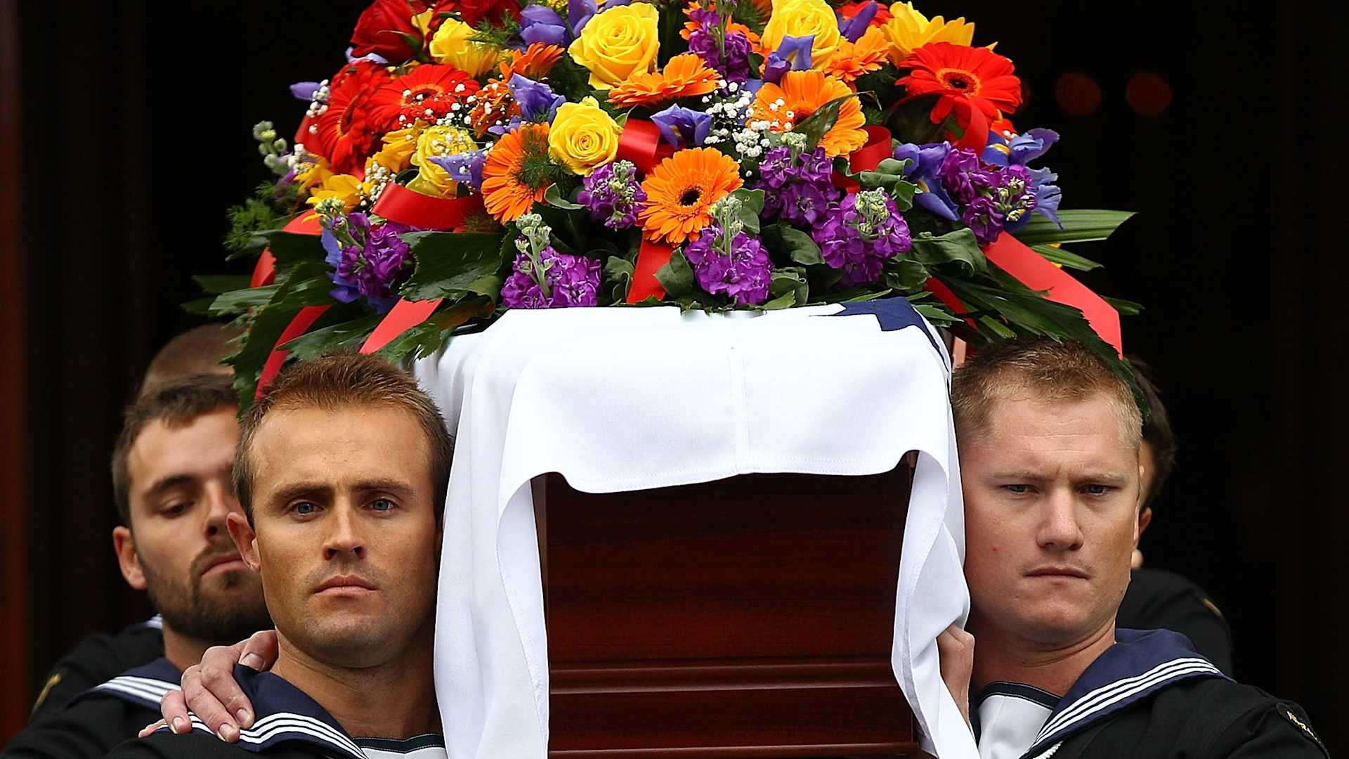 PERTH, AUSTRALIA - MAY 20: Naval Pallbearers carry the coffin of Mr Claude Choules from the church during the funeral service on May 20, 2011 in Perth, Australia. At the time of his death, Mr Choules was the last known WW1 combat veteran, the last known veteran to have served in both world wars and at 110, the oldest living Australian. Choules was born in the United Kingdom and served for the both the Royal Navy and Royal Australian Navy. (Photo by Paul Kane/Getty Images)