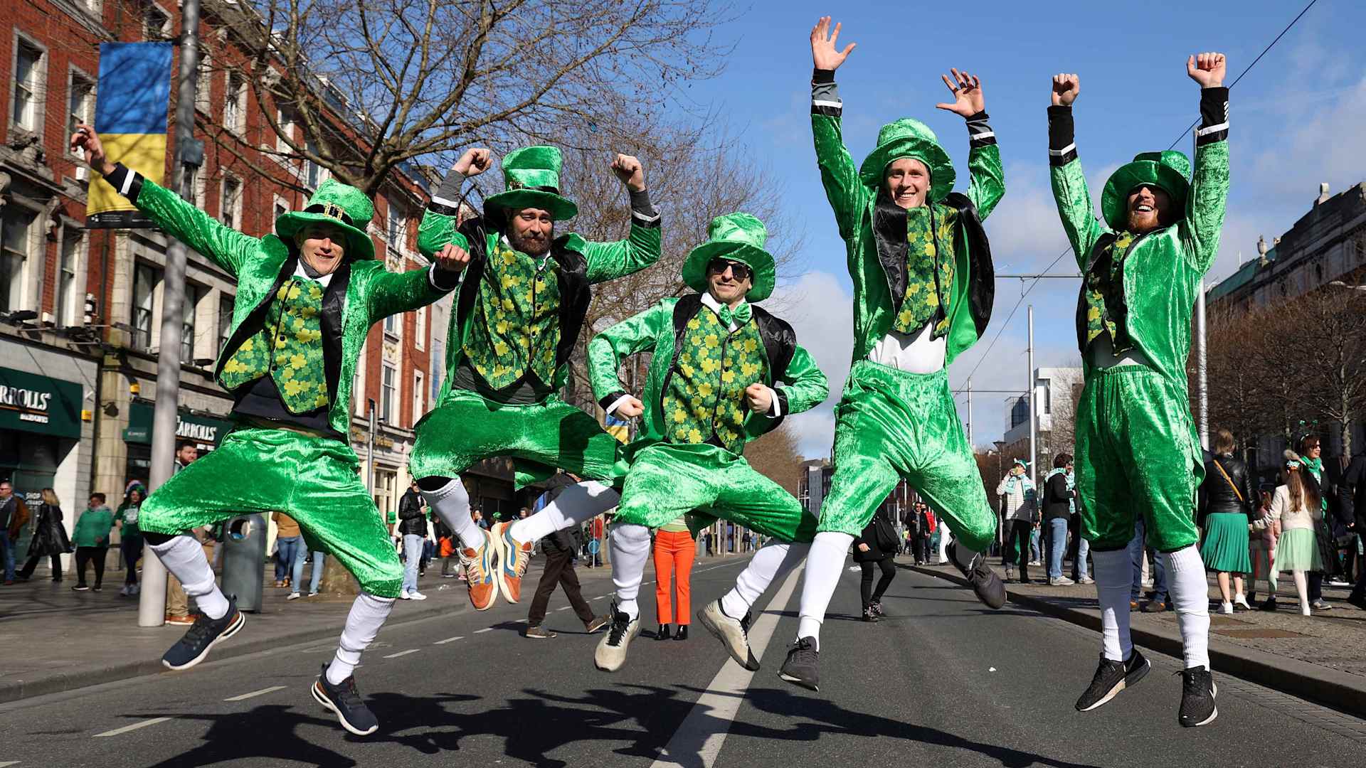 Revellers dressed in green pose photo during the the annual St Patrick's Day parade in Dublin on March 17, 2022.