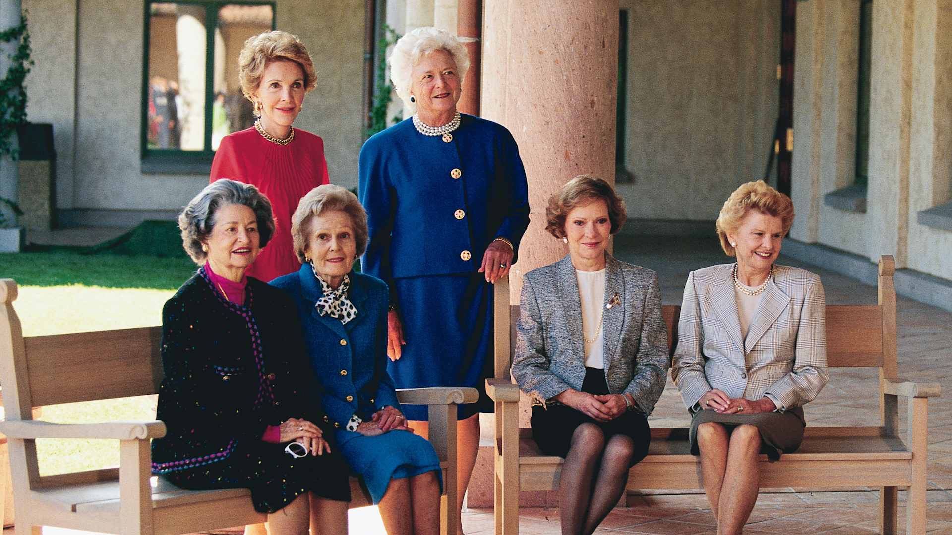 Portrait of former US First Ladies, seated from left, Lady Bird Johnson, Pat Nixon, Rosalynn Carter, and Betty Ford and, standing from left, Nancy Reagan and First Lady Barbara Bush, as they pose together at the opening of the Ronald Reagan Library, Simi Valley, California, November 4, 1991.