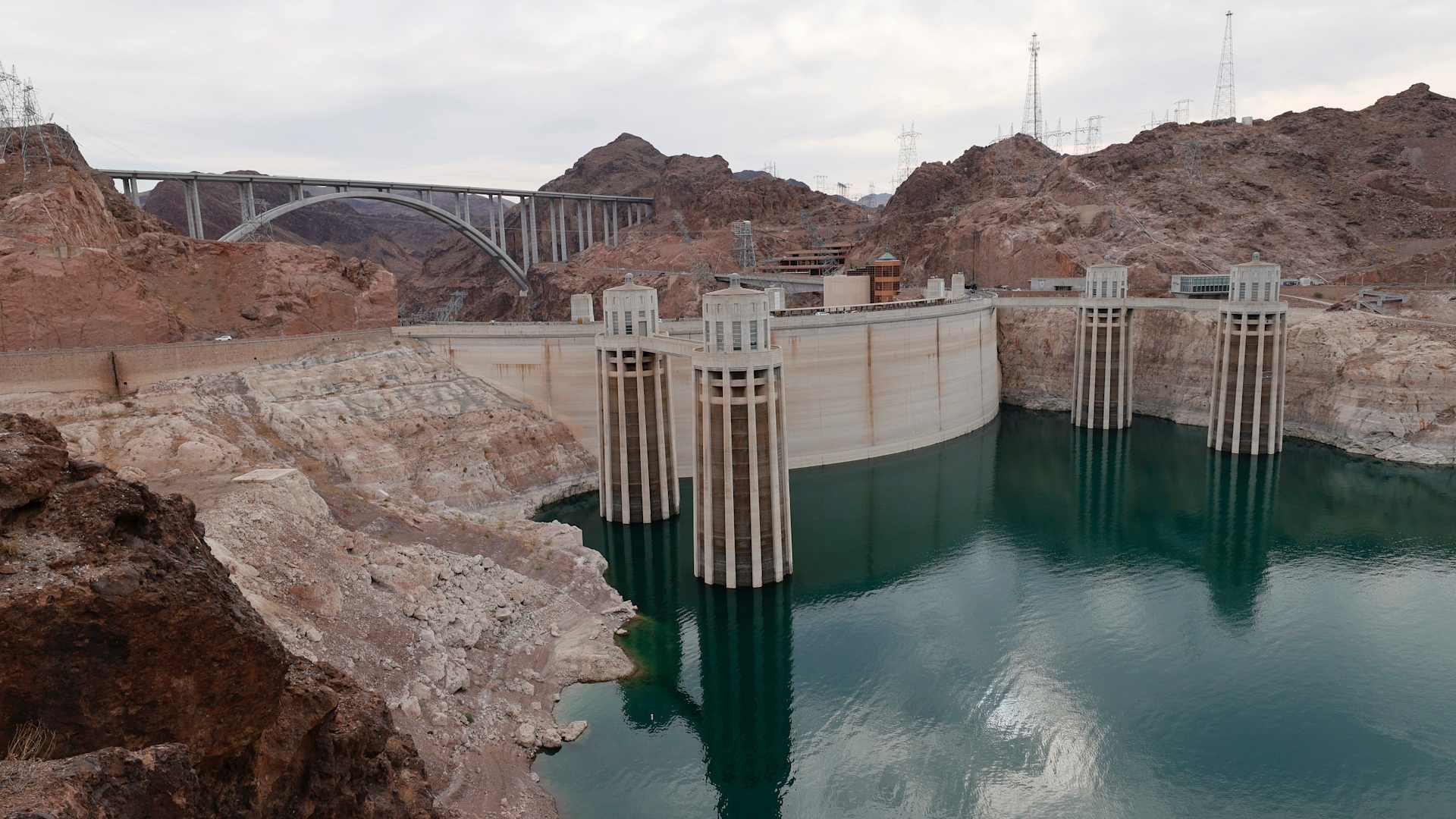 LAKE MEAD NATIONAL RECREATION AREA, ARIZONA - JUNE 15: The Arizona Intake Towers (L) and Nevada Intake Towers on the upstream side of the Hoover Dam are shown on June 15, 2021 in the Lake Mead National Recreation Area, Arizona. Last week, The U.S. Bureau of Reclamation reported that Lake Mead, North America's largest artificial reservoir, dropped to 1,071.53 feet above sea level, the lowest it's been since being filled in 1937 after the construction of the Hoover Dam. The declining water levels are a result of a nearly continuous drought for the past two decades coupled with increased water demands in the Southwestern United States. (Photo by Ethan Miller/Getty Images)