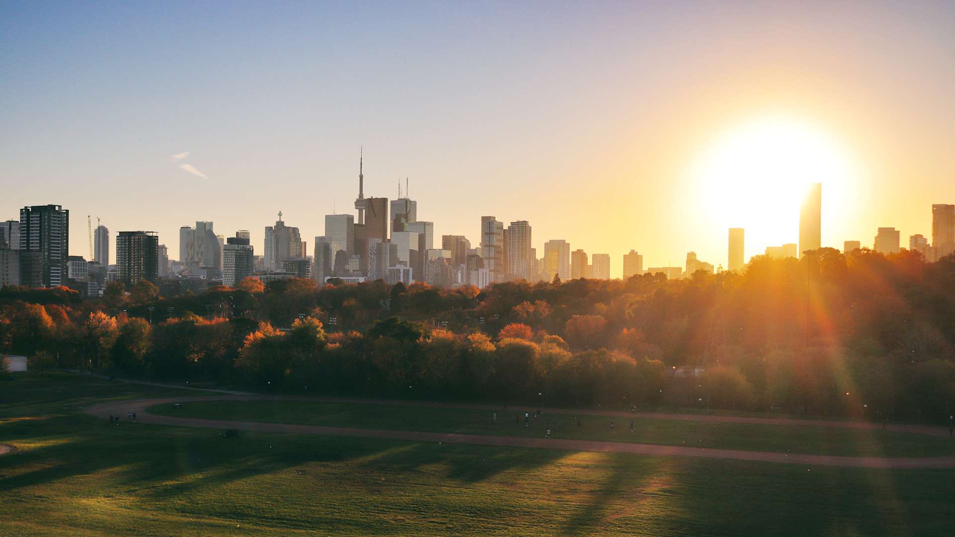 Gorgeous sunset in Toronto on a lovely day in November. The characteristic Toronto skyline with the famous CN tower grace the horizon. As seen from Riverdale Park East, Broadview.