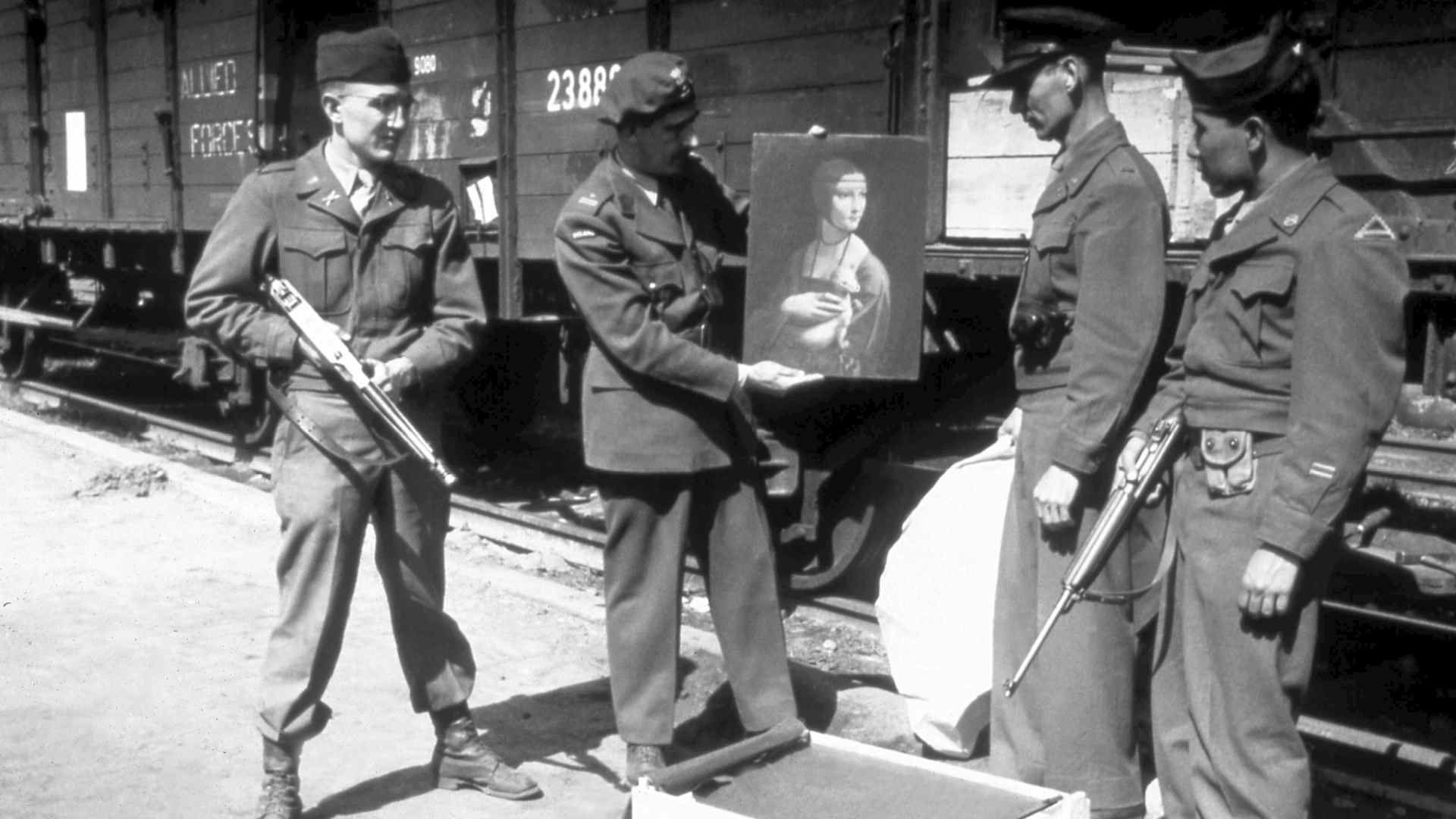 USA/Poland: Monuments, Fine Arts, and Archives representative Everett Parker Lesley, Jr. (left) returning Leonardo da Vinci's 'Lady with an Ermine' to its home in Krakow, 1946. (Photo by: Pictures from History/Universal Images Group via Getty Images)