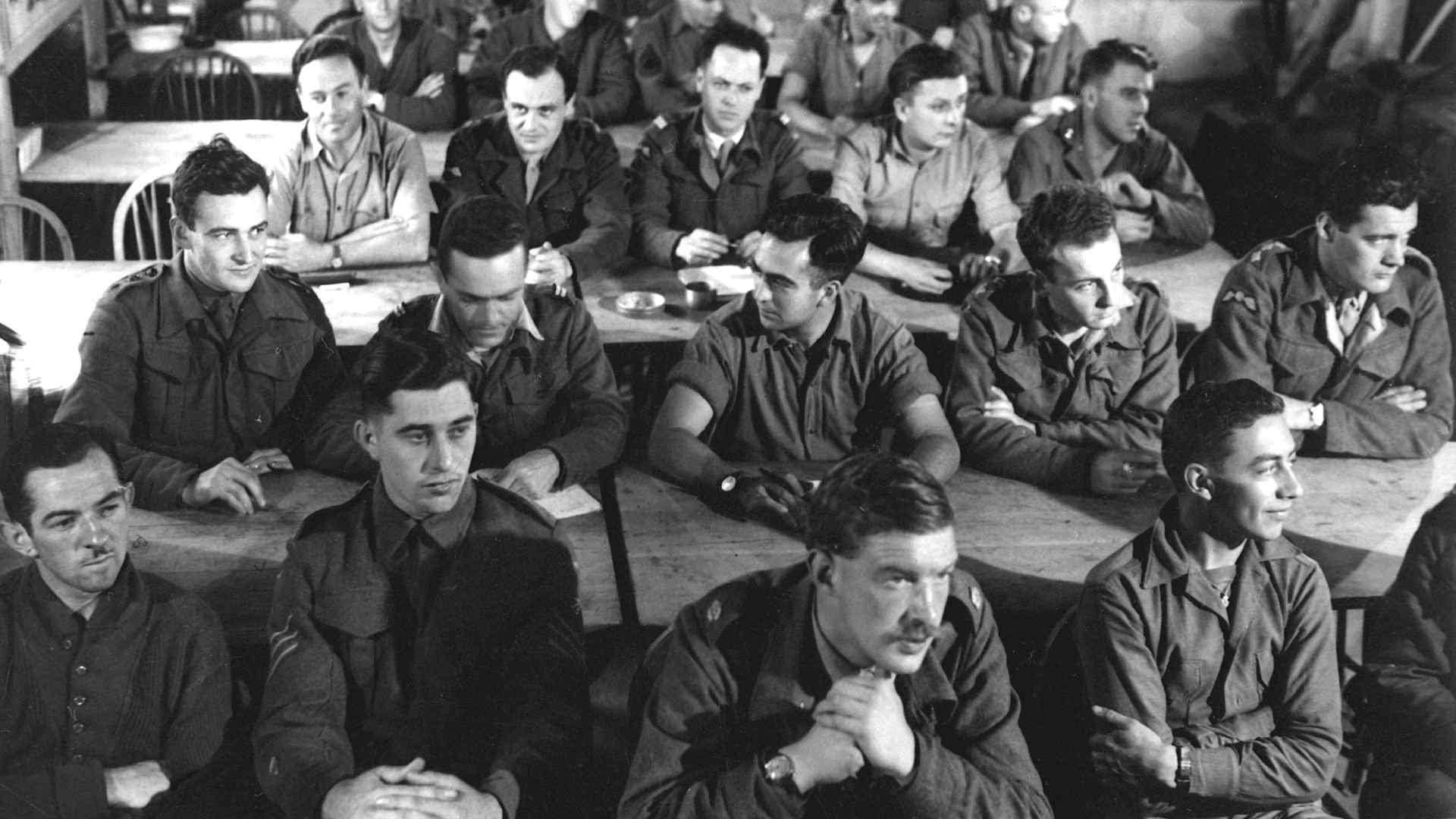 View of the audience, seated in rows and listening during a demolition class, in England, 1944. Office of Strategic Services photo. (Photo by Interim Archives/Getty Images)