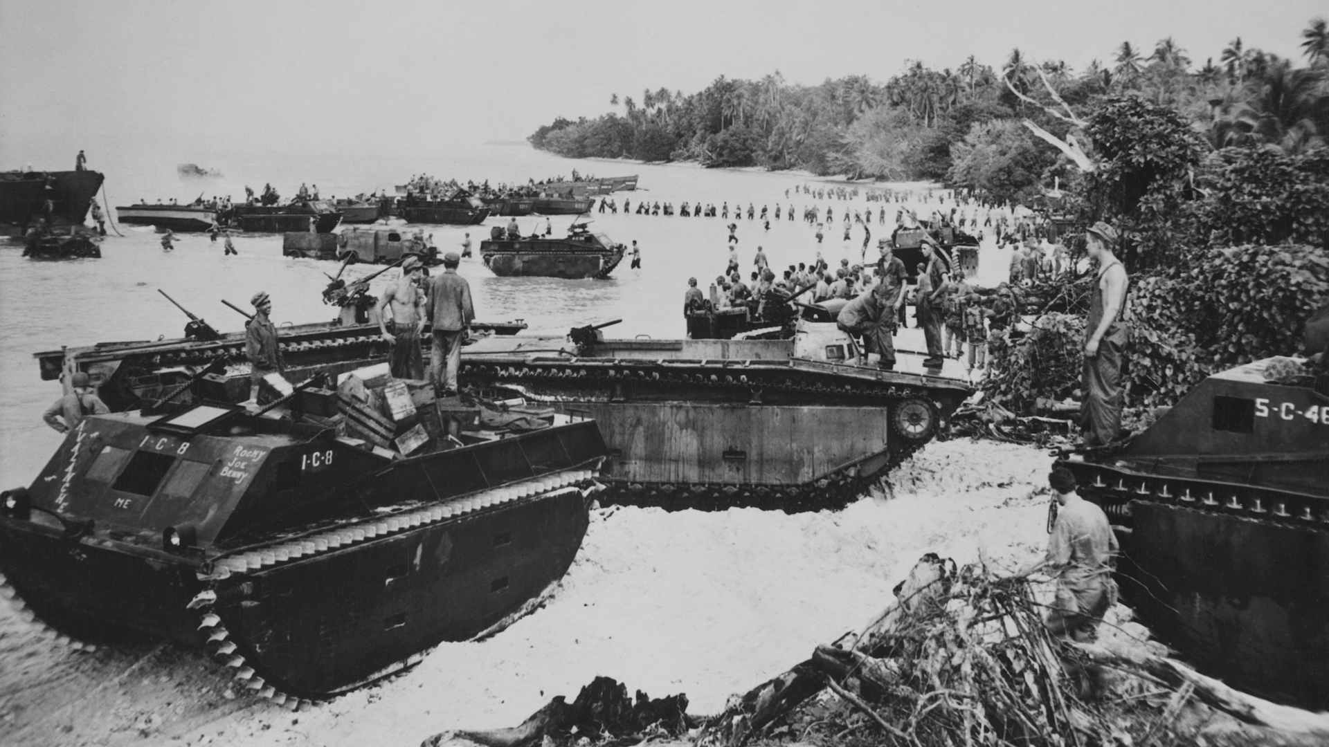 Equipment, supplies and US Marines from the 1st and 2nd Battalions of the 4th Marine Division, I Marine Amphibious Corps come ashore from amphibious Landing Vehicle Tracked Mark I (LVT) and LVT-2 Water Buffalo's onto the beach during Operation Cartwheel on 20th March 1944 at Emirau Island in the Bismarck Archipelago in the south eastern portion of the St. Matthias Islands of Papua New Guinea. US Navy Official Photo (Photo by FPG/Archive Photos/Getty Images).