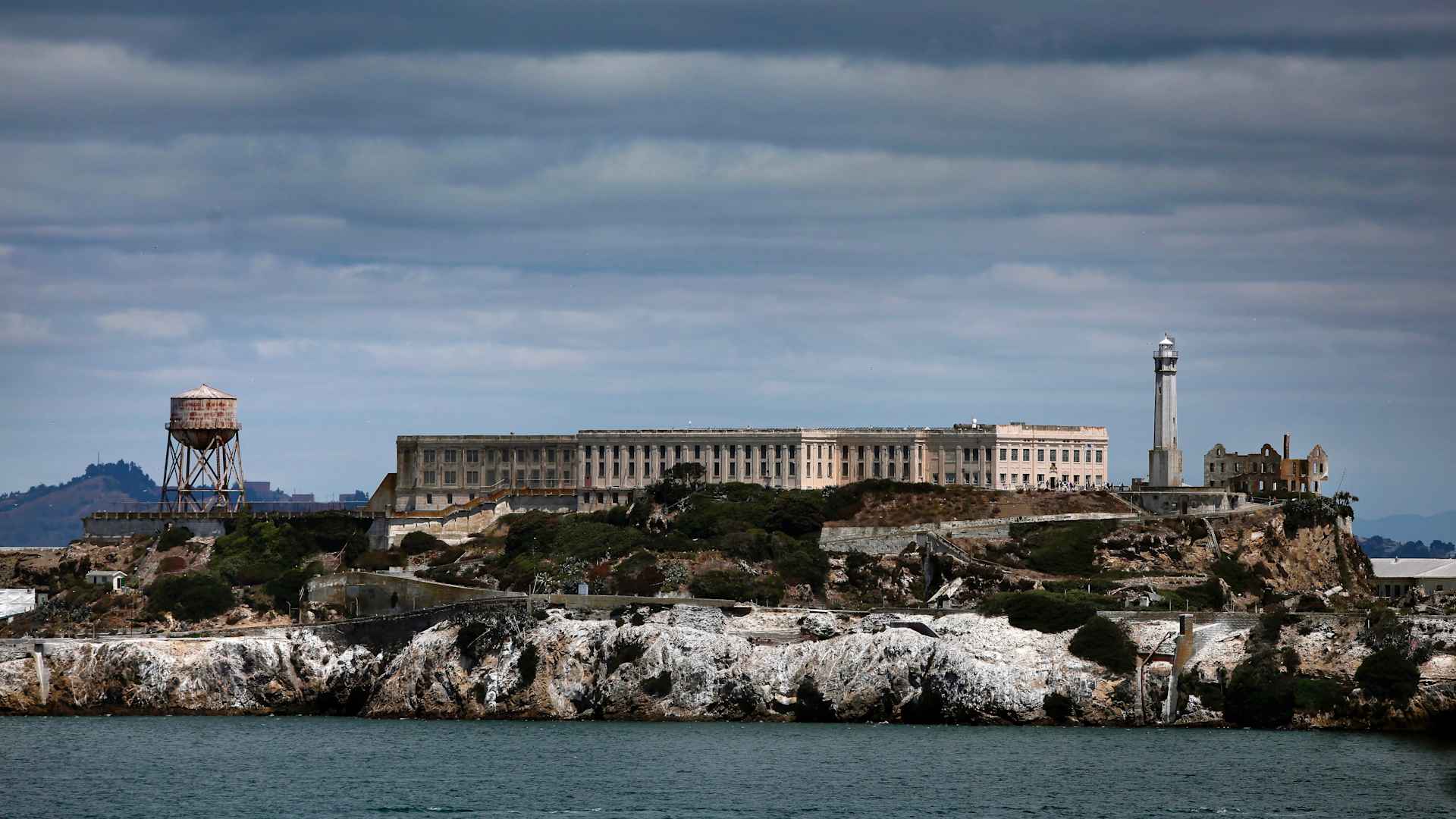 The commemoration of the 75th anniversary of Alcatraz as a federal prison. The commemoration organizers plan to use the occasion to raise funds to repair island's the old lighthouse keeper?s home and the social club for families, both damaged in the Indian uprisings of the early 1970s. So both structures might be good candidates to shoot.