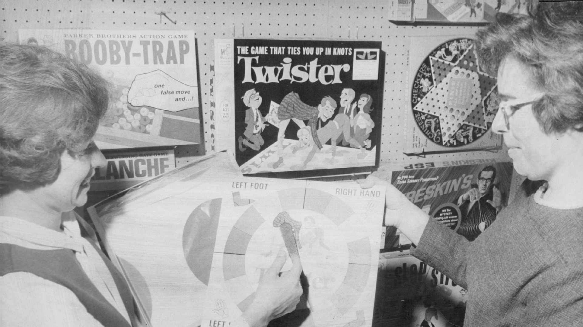 DEC 6 1967, DEC 9 1967; Mrs. Anthony Gavito Jr., left, and Miss Nadine Murray, 7100 W. 67th Ave., look over Twister game. They were checking toys in preparation for Christmas party.; (Photo By Ed Maker/The Denver Post via Getty Images)