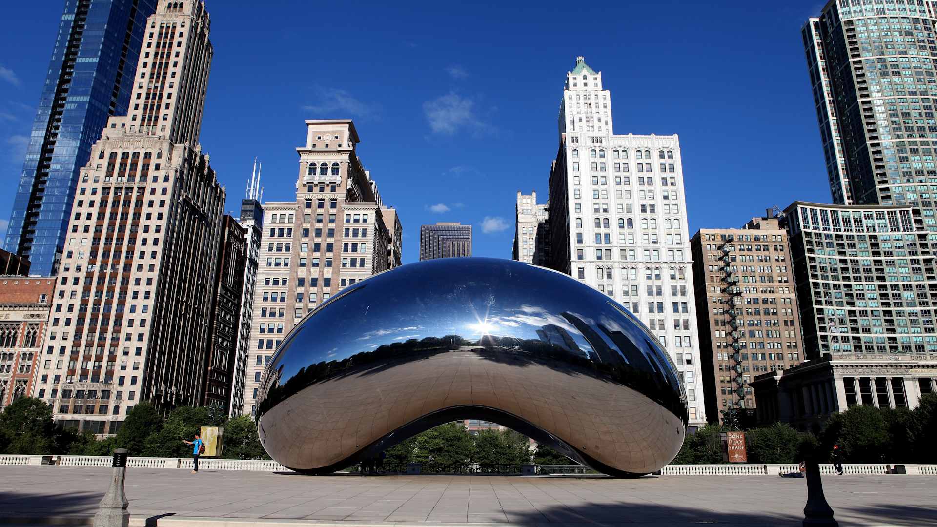 CHICAGO - JULY 24: Anish Kapoor's "Cloud Gate", with buildings from the Michigan Avenue skyline in view in Chicago, Illinois on JULY 24, 2013. (Photo By Raymond Boyd/Getty Images)