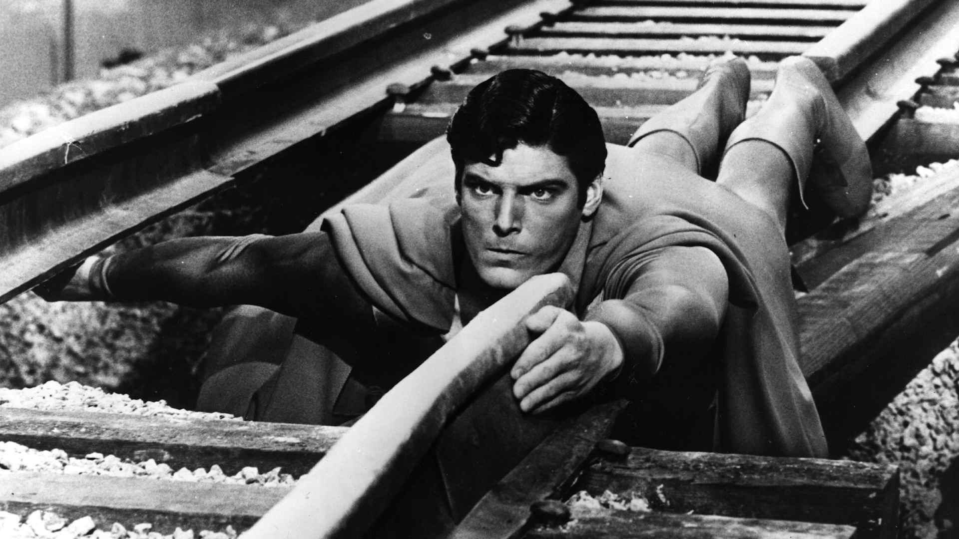 24-year-old American actor Christopher Reeve plays the comic-book hero as he mends a broken railway track in a scene from the film 'Superman'.