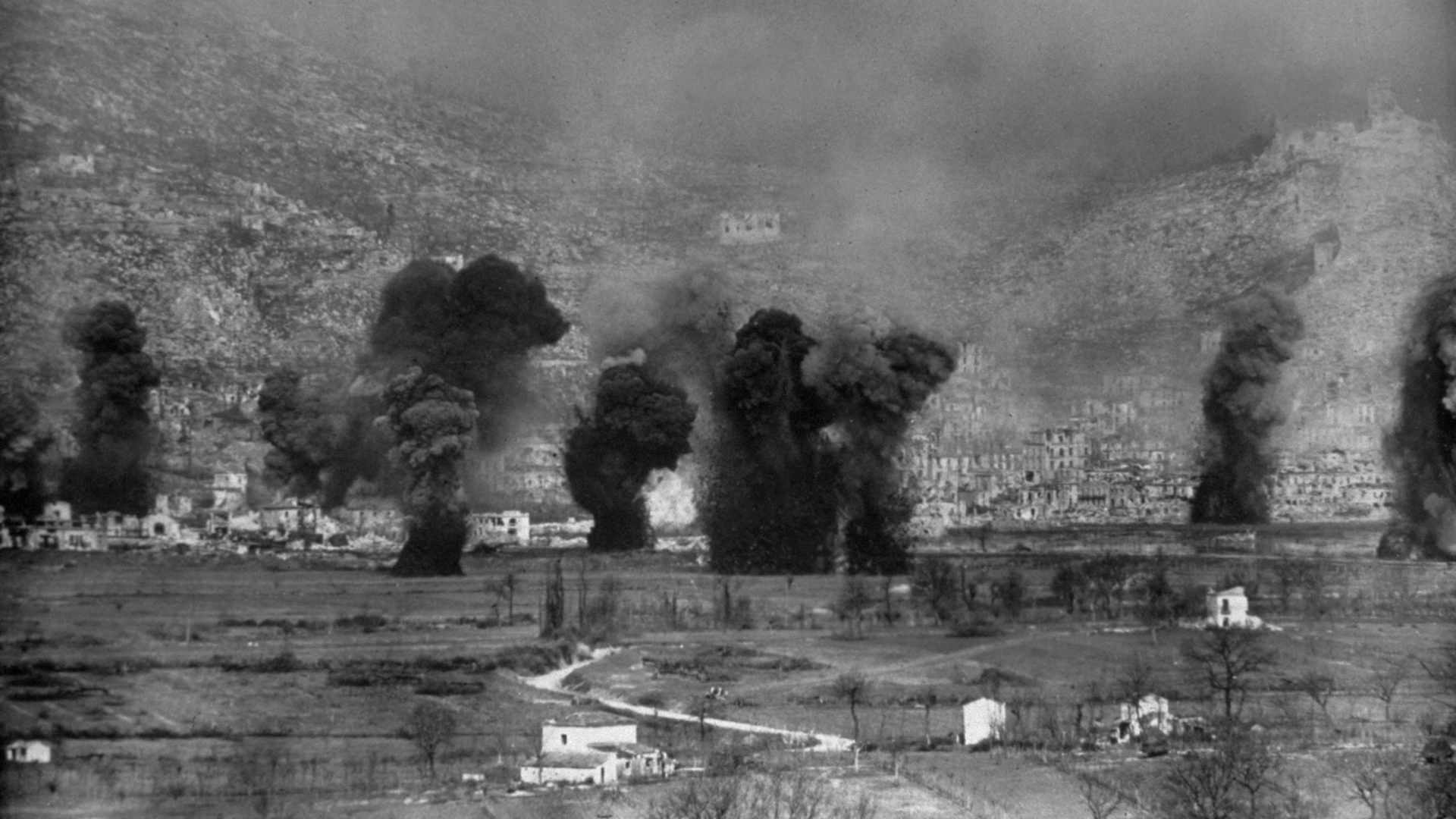 circa 1944: Earth and rubble are thrown skyward as Allied planes and guns pound Monte Cassino, the German bastion in Western Italy, during the Italian Campaign.